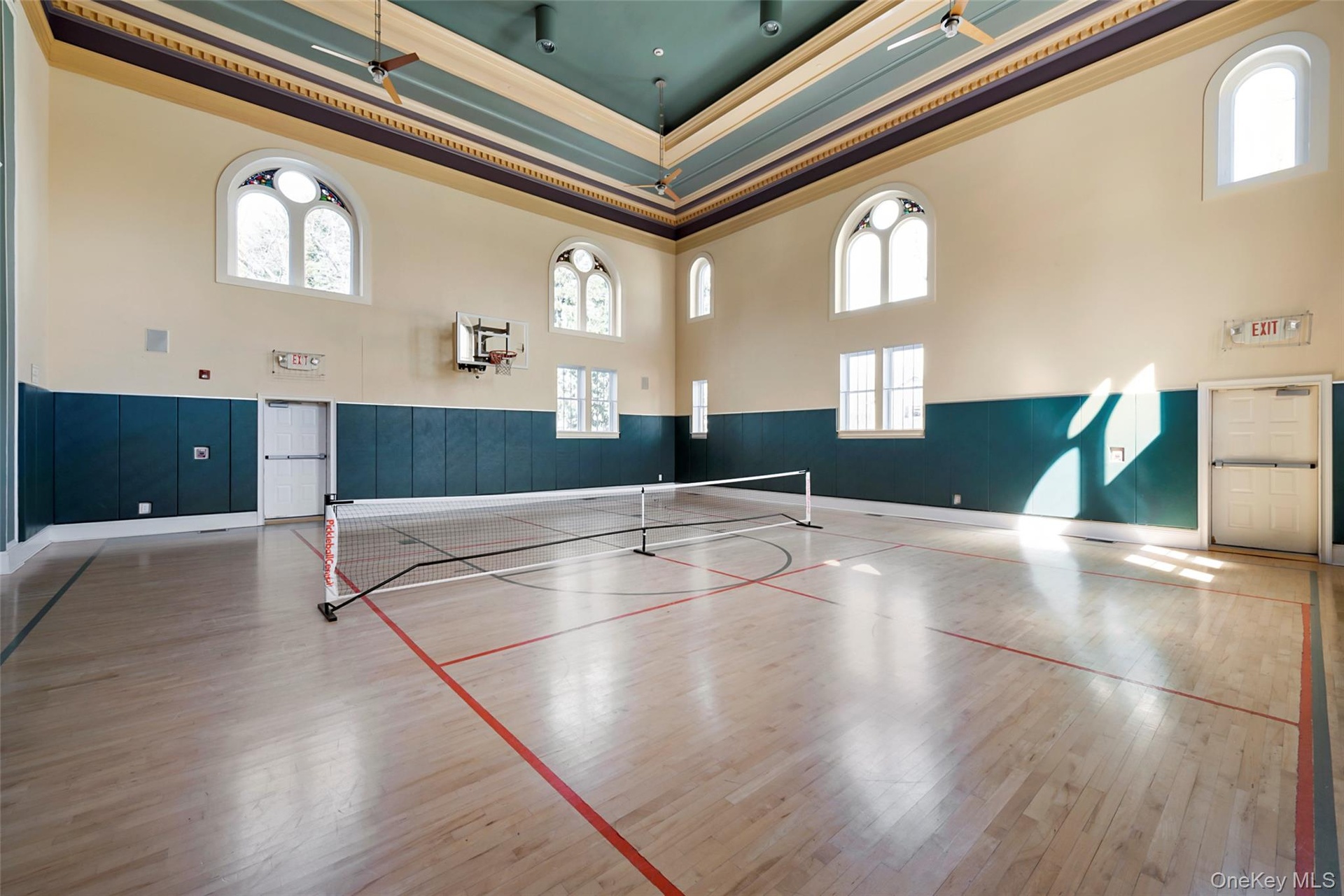 View of basketball court with tennis court