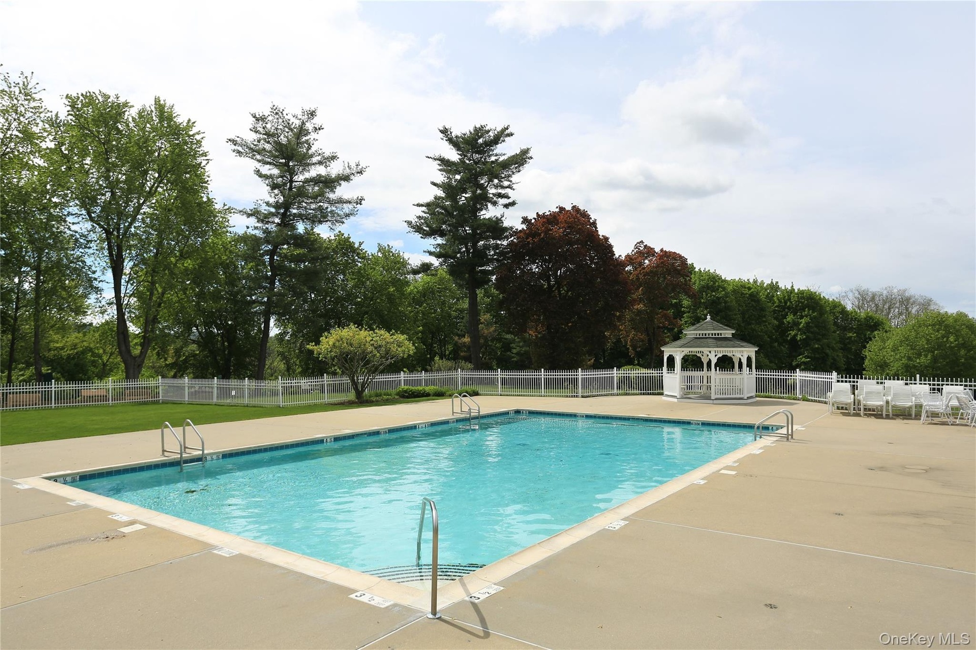 View of swimming pool with a gazebo and a patio area
