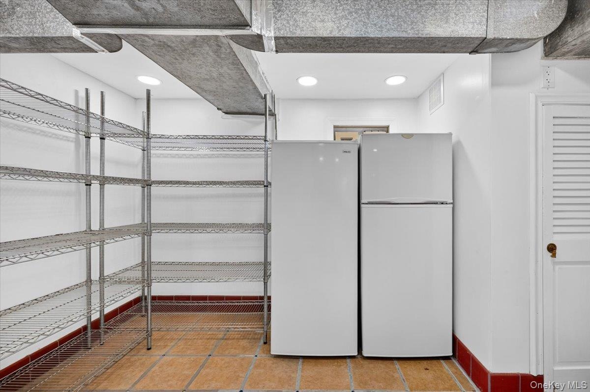 Storage Room with Extra Refrigerator in the Basement