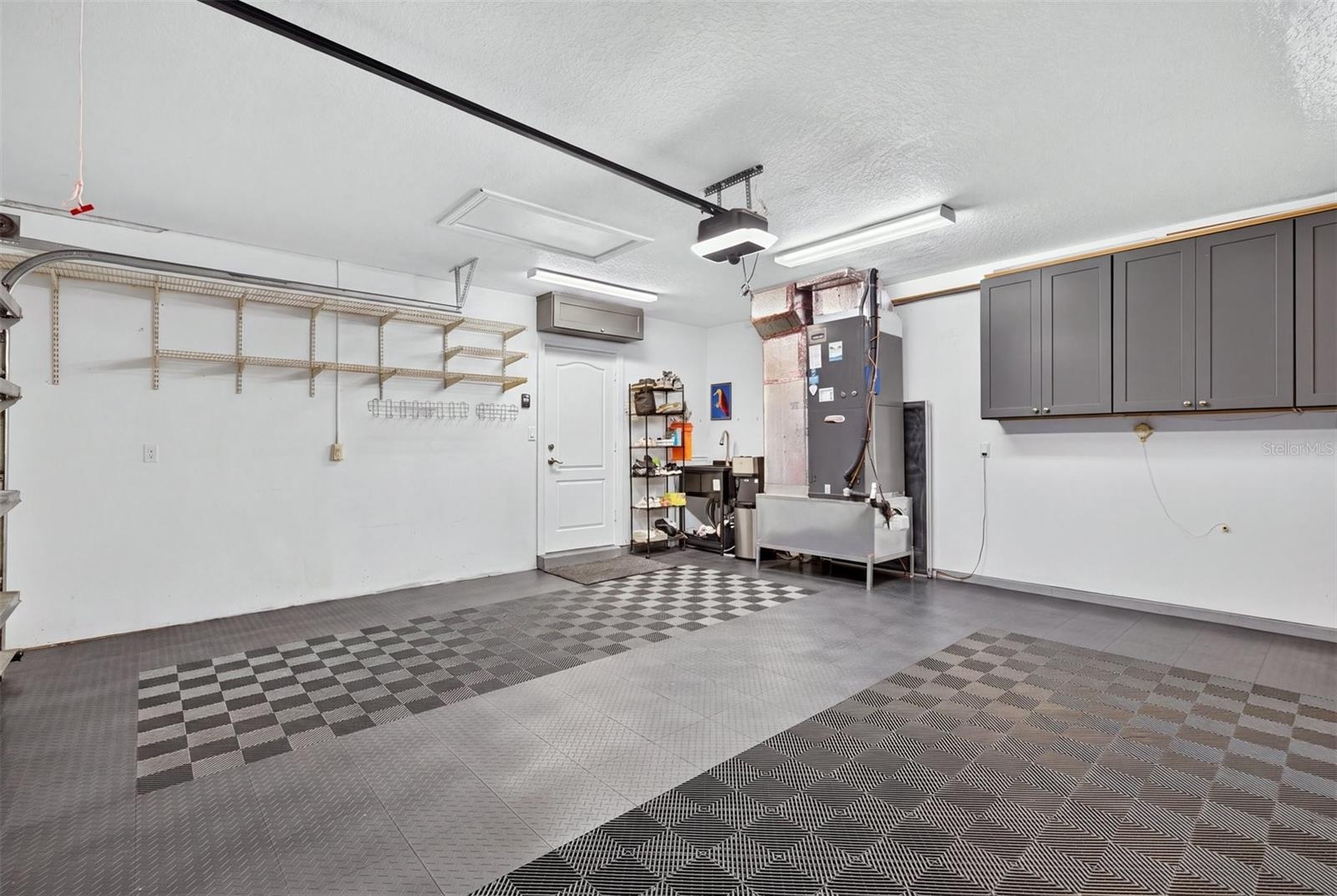 Garage with sink and HVAC relocated