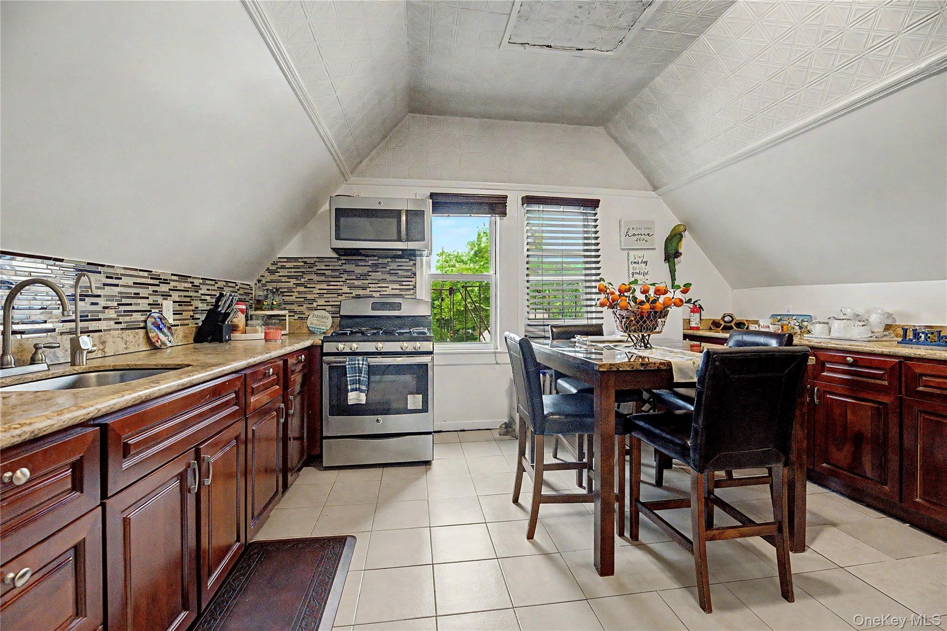 Updated eat-in kitchen with abundant cabinetry and counter space.