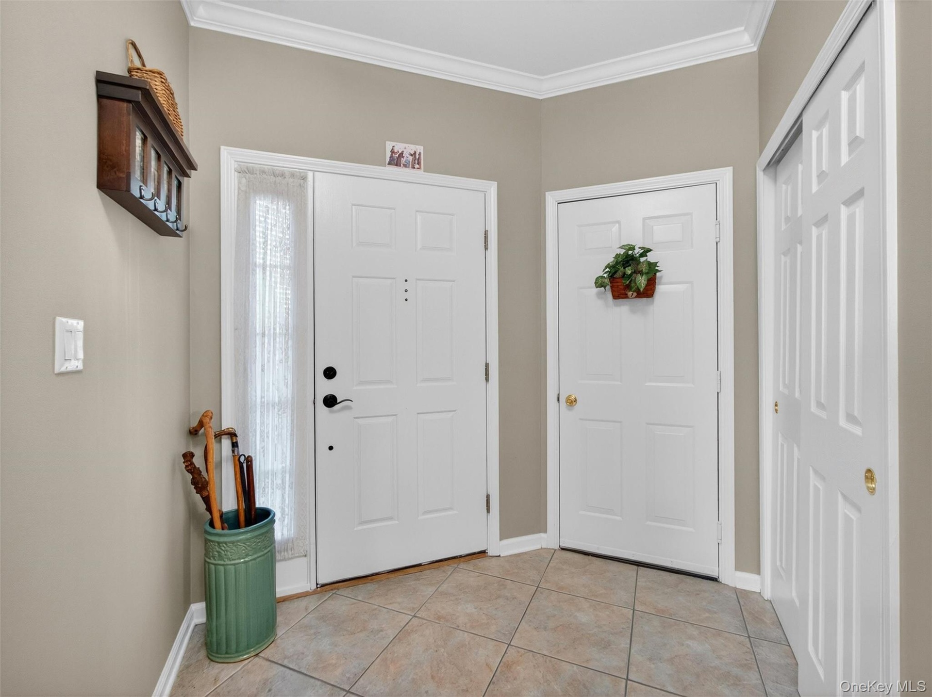 Doors leading to the entry pathway, the garage, and a closet.