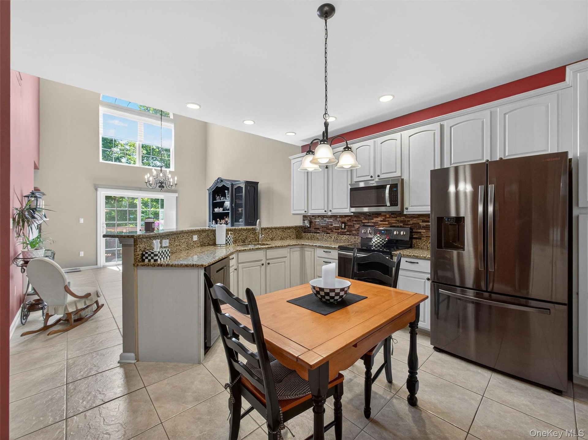 View from the updated chef-friendly kitchen through the dining room and out to the deck.