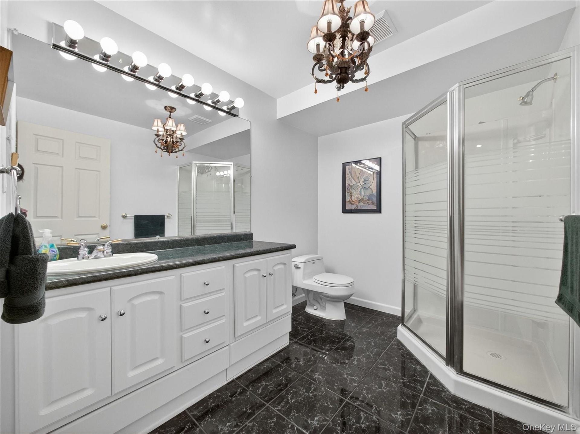 Tasteful fully finished bathroom in the basement.
