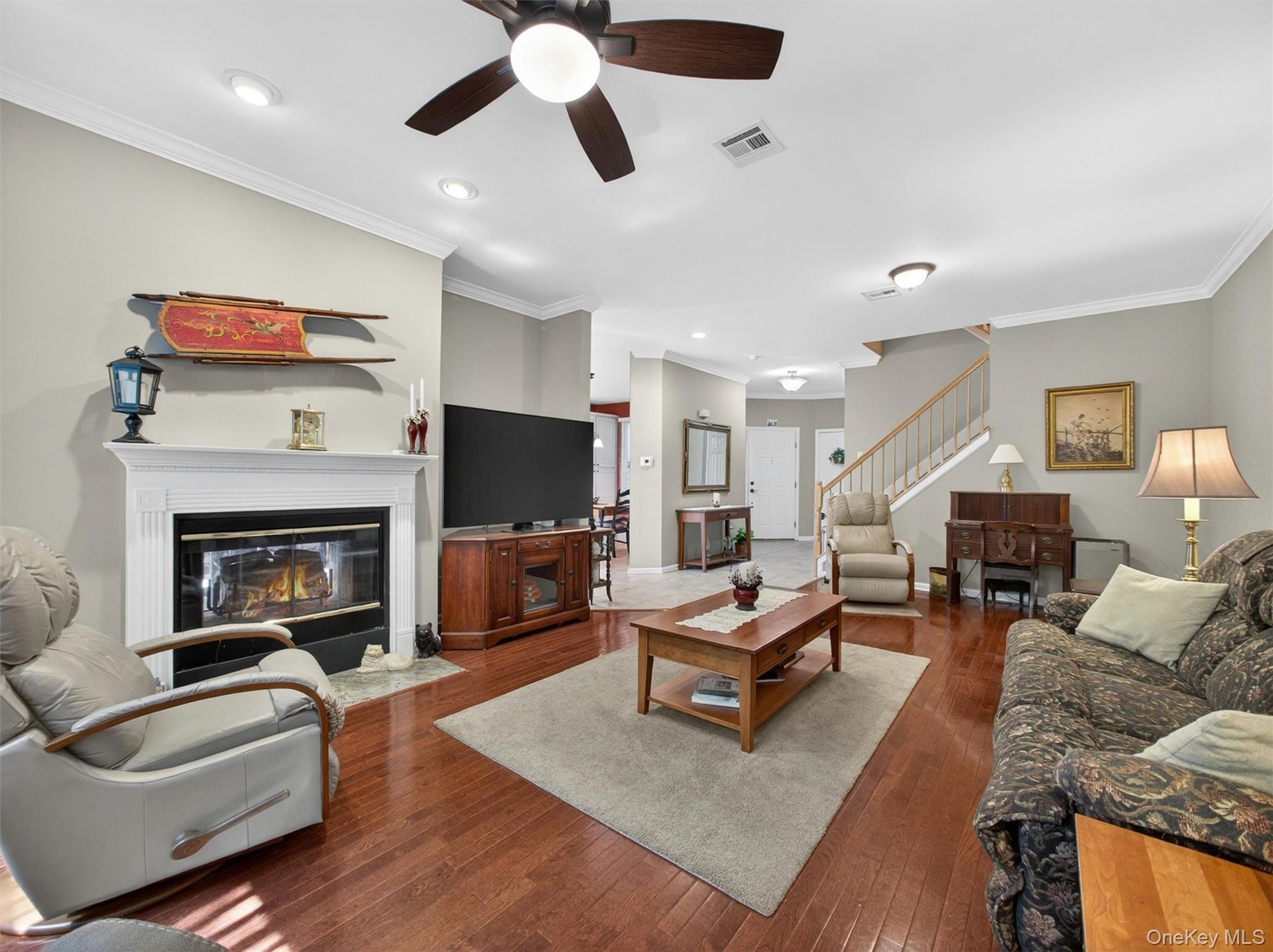 View from the expansive living room with "see-through" fireplace, through to the entry foyer.