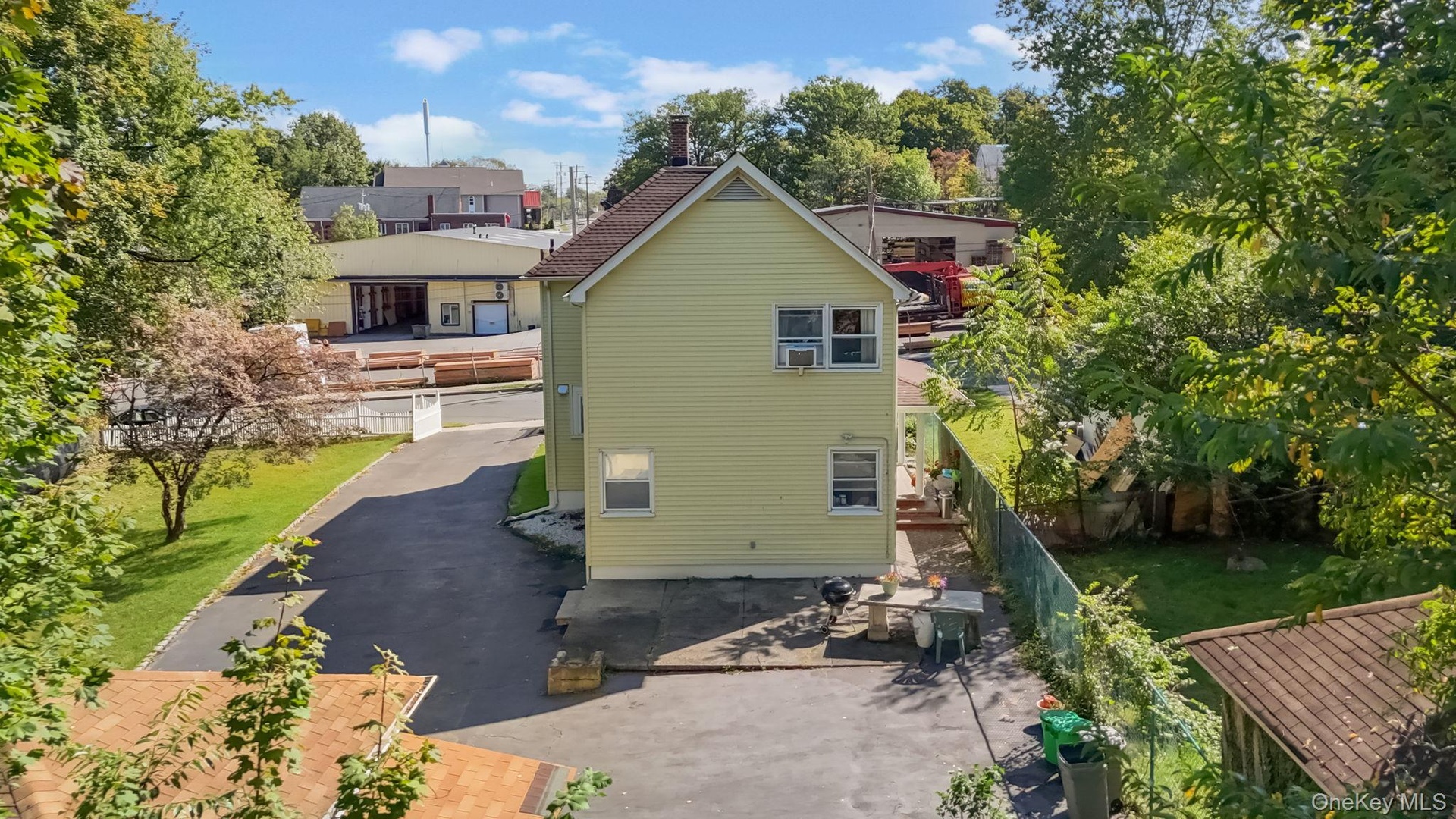 Back of property with a patio area and a balcony
