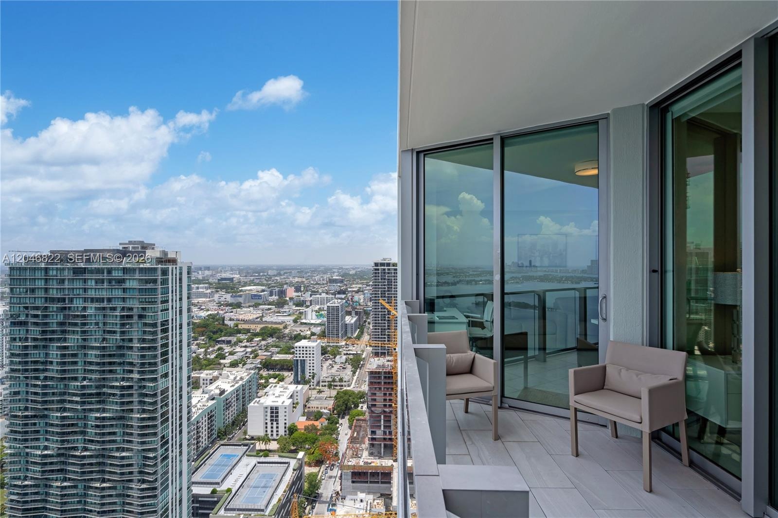 Furnished balcony with panoramic city and bay outlook