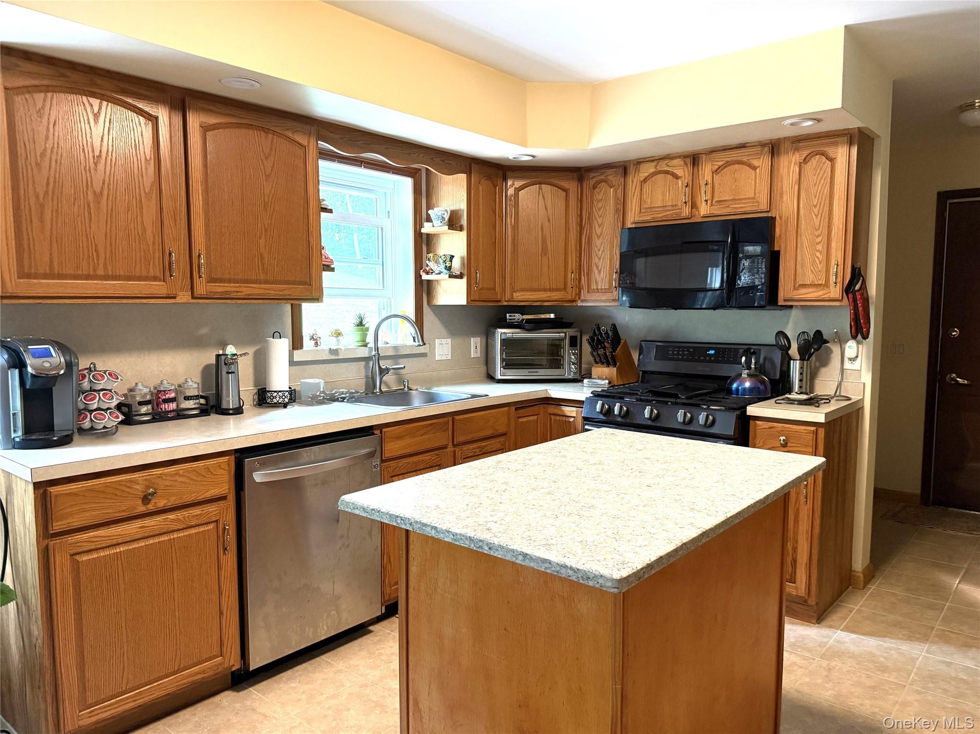 Island offers a granite top. Propane range.