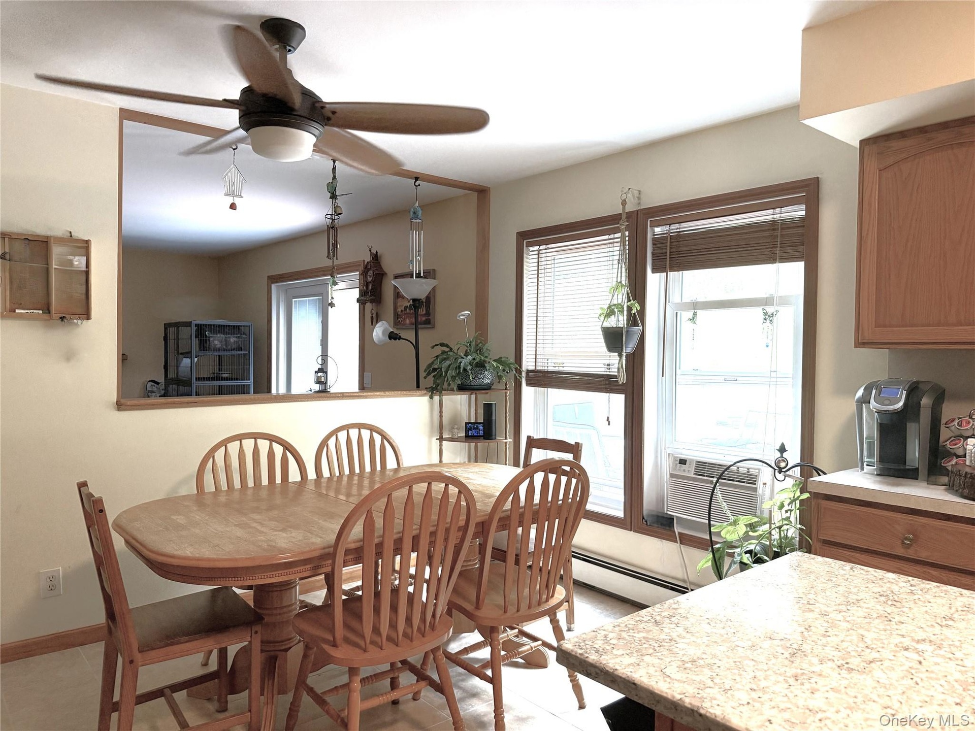 Spacious dining area fits a full-size dining table. The large opening looks into the family room.