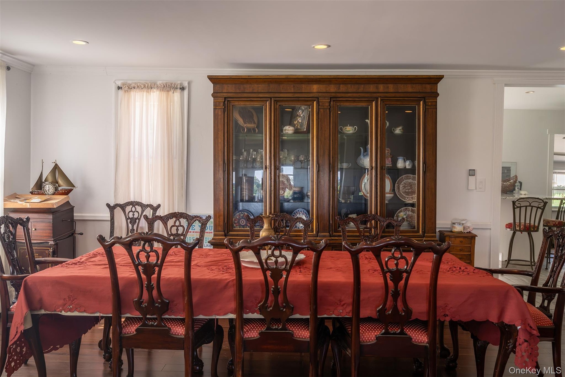 Expansive dining room between the front living room and large farmhouse kitchen behind.  Floors are amazing and the updates keep the original wood det