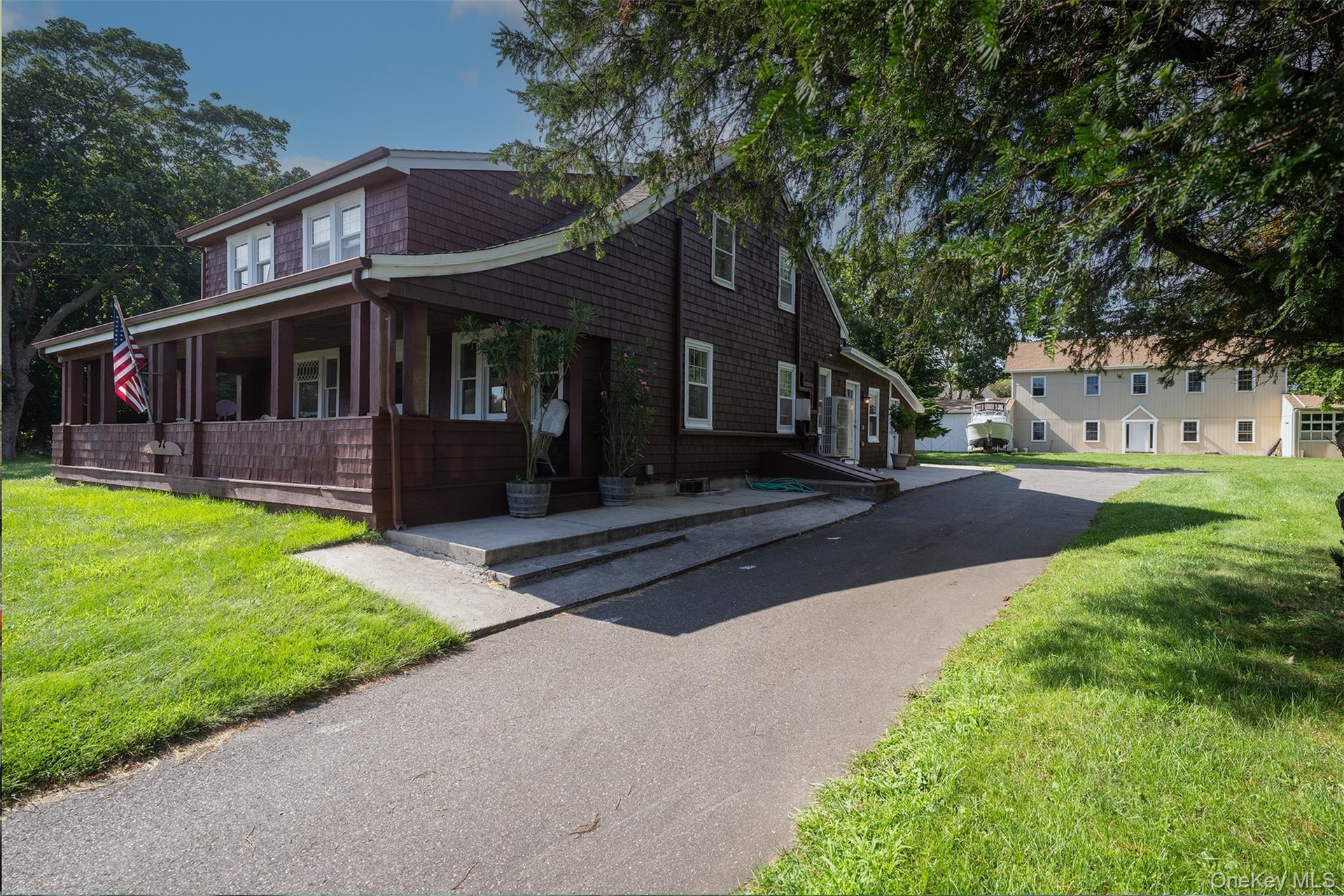 The amazing wide front porch was added with the second floor dormers by Edwin King in the 1920's.  He also purchased and moved the barn from the Orien