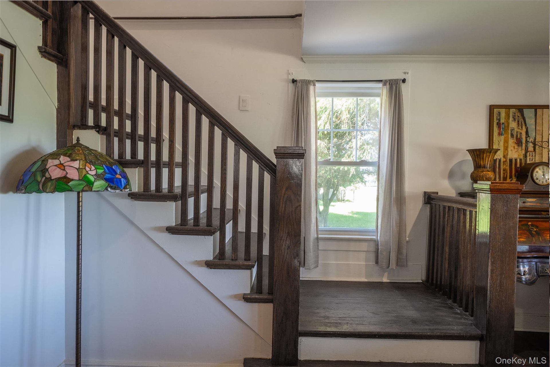 Beautiful front and rear staircases brings the charm and character of this historic Craftsman home together. The back stairs come from the bedrooms to