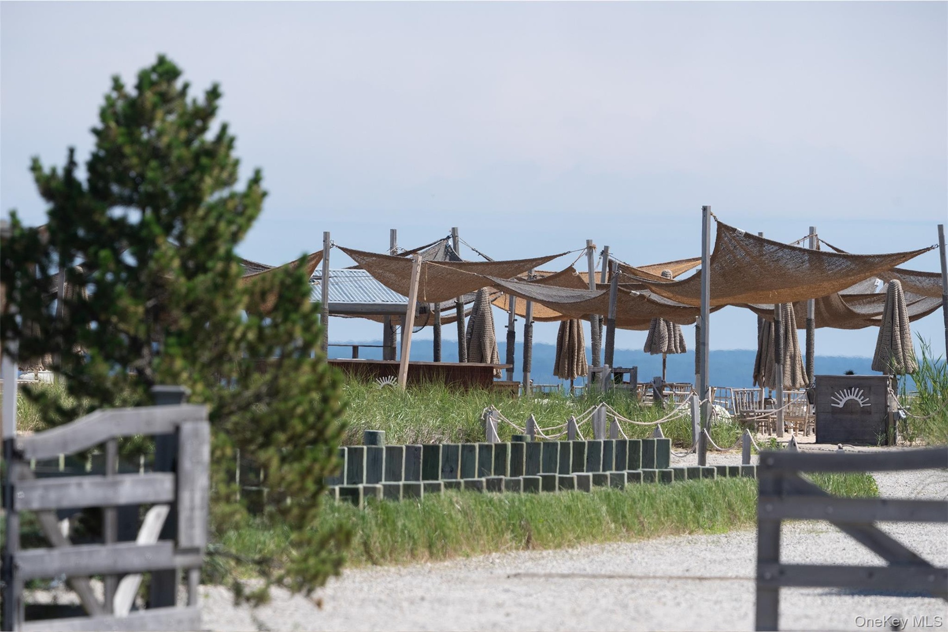 Duryea's outdoor dining with stunning views of the boats and beach lined shores across the street.