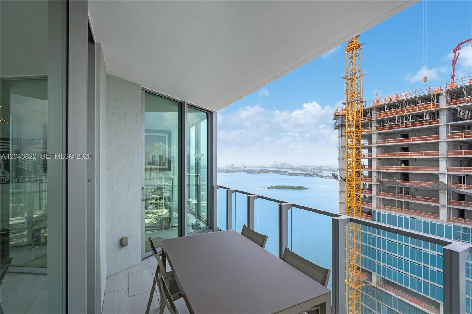 Wraparound terrace with seating and sweeping Biscayne Bay views