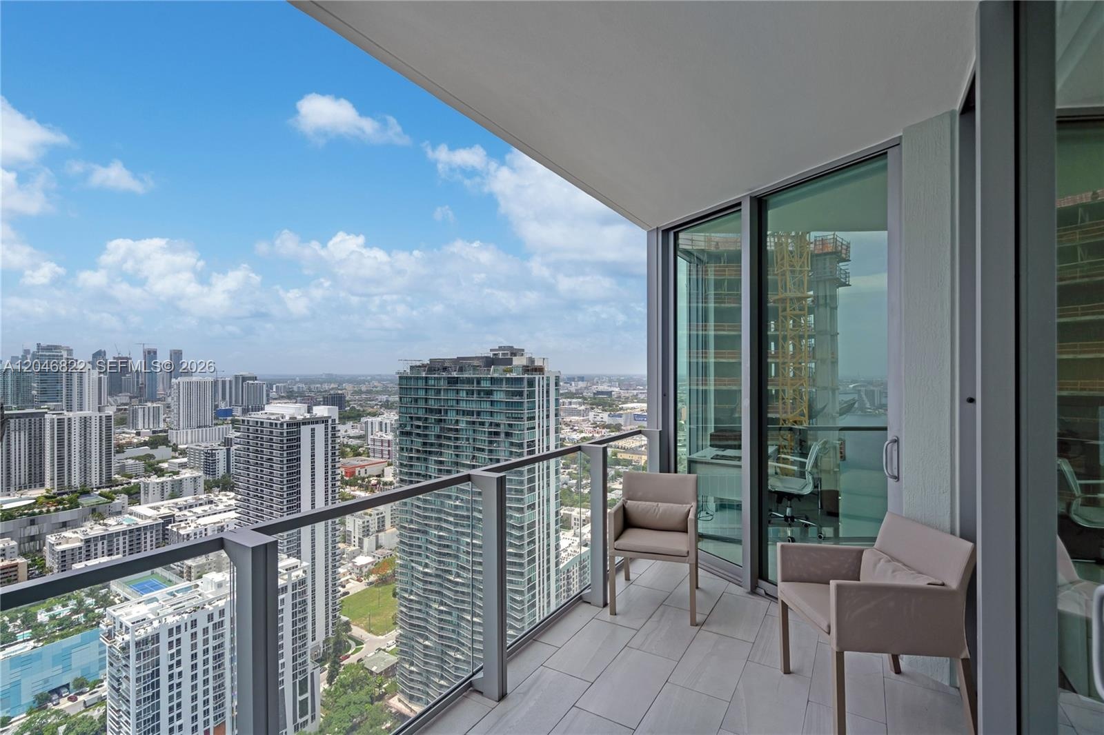 Terrace lounge overlooking the Edgewater waterfront and skyline