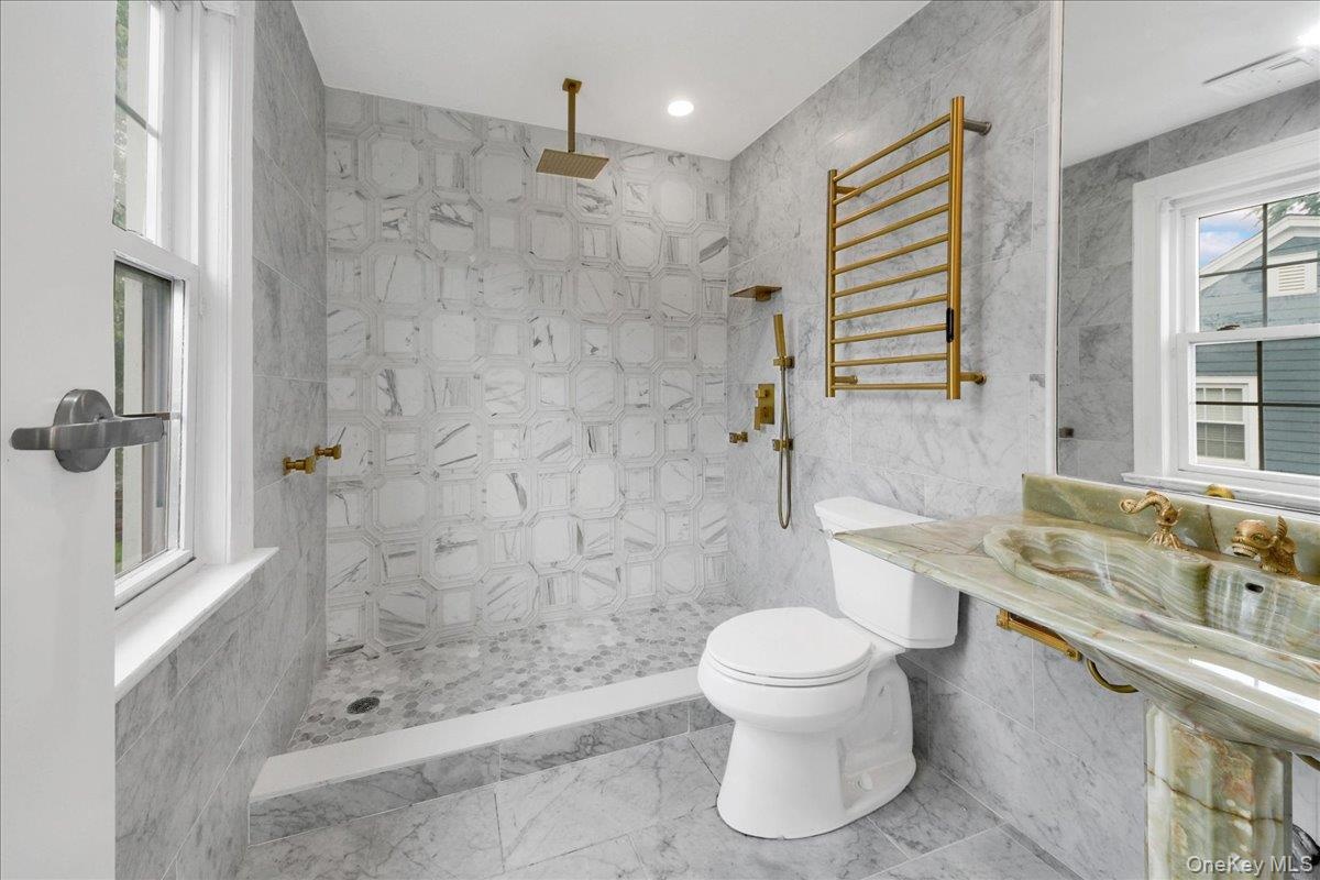 Upated Primary bathroom with tiled carrera Mable