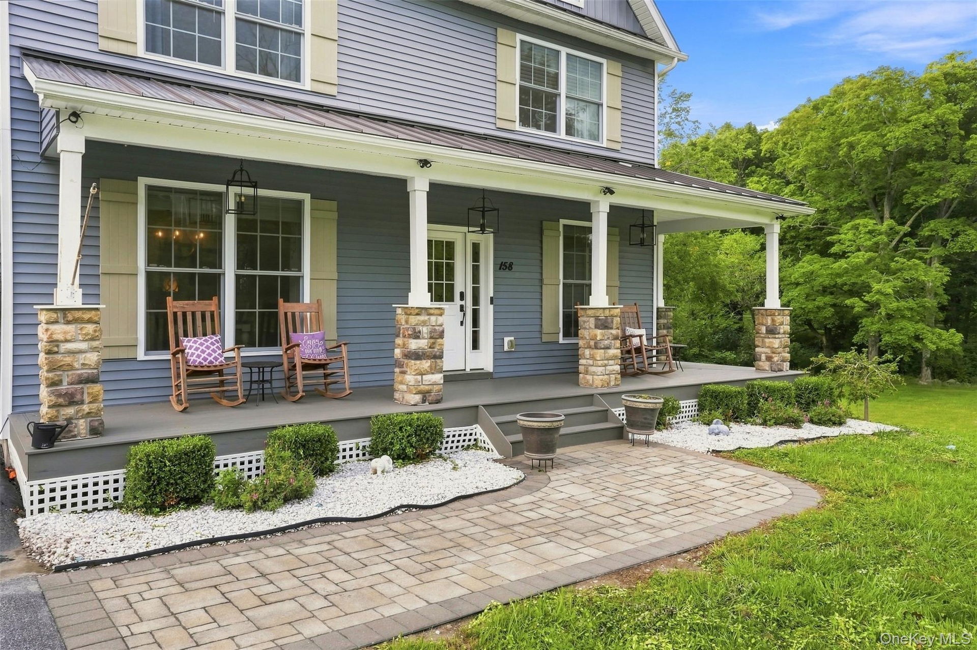Classic rocking chair covered front porch, a home you will be proud to call your own