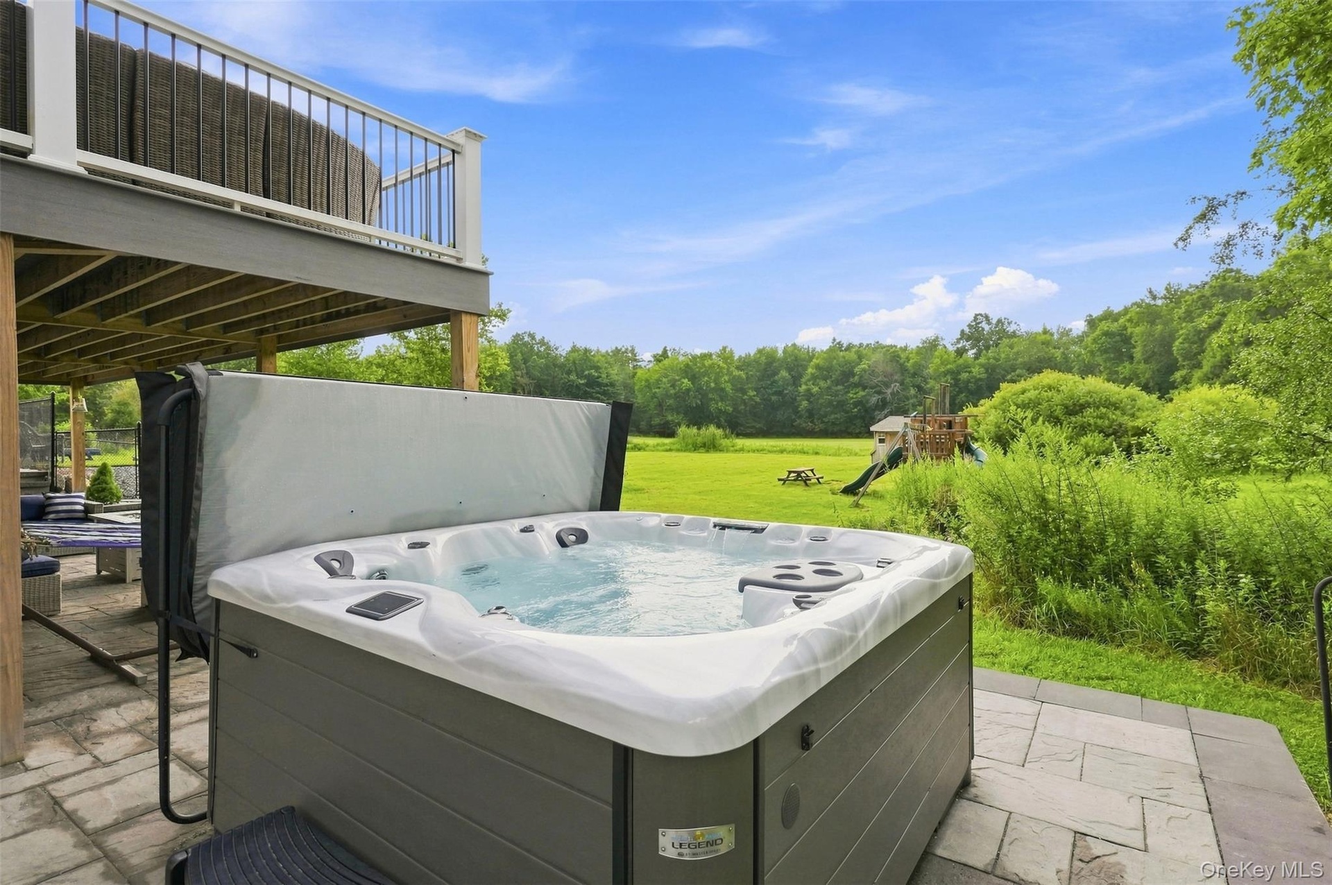 Paver patio easily accessible from the basement or top deck