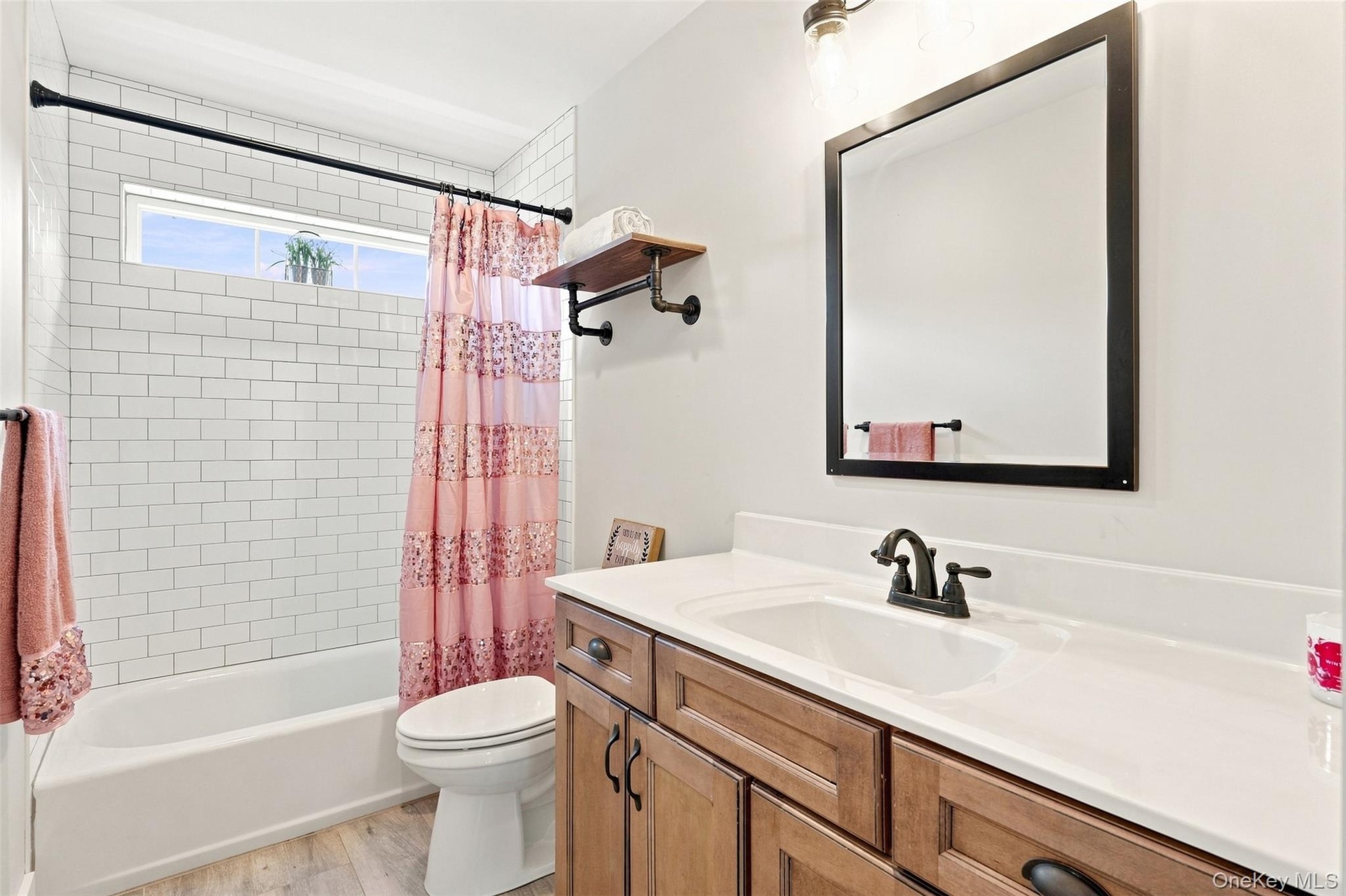 Shared full bathroom with bathtub/shower combo