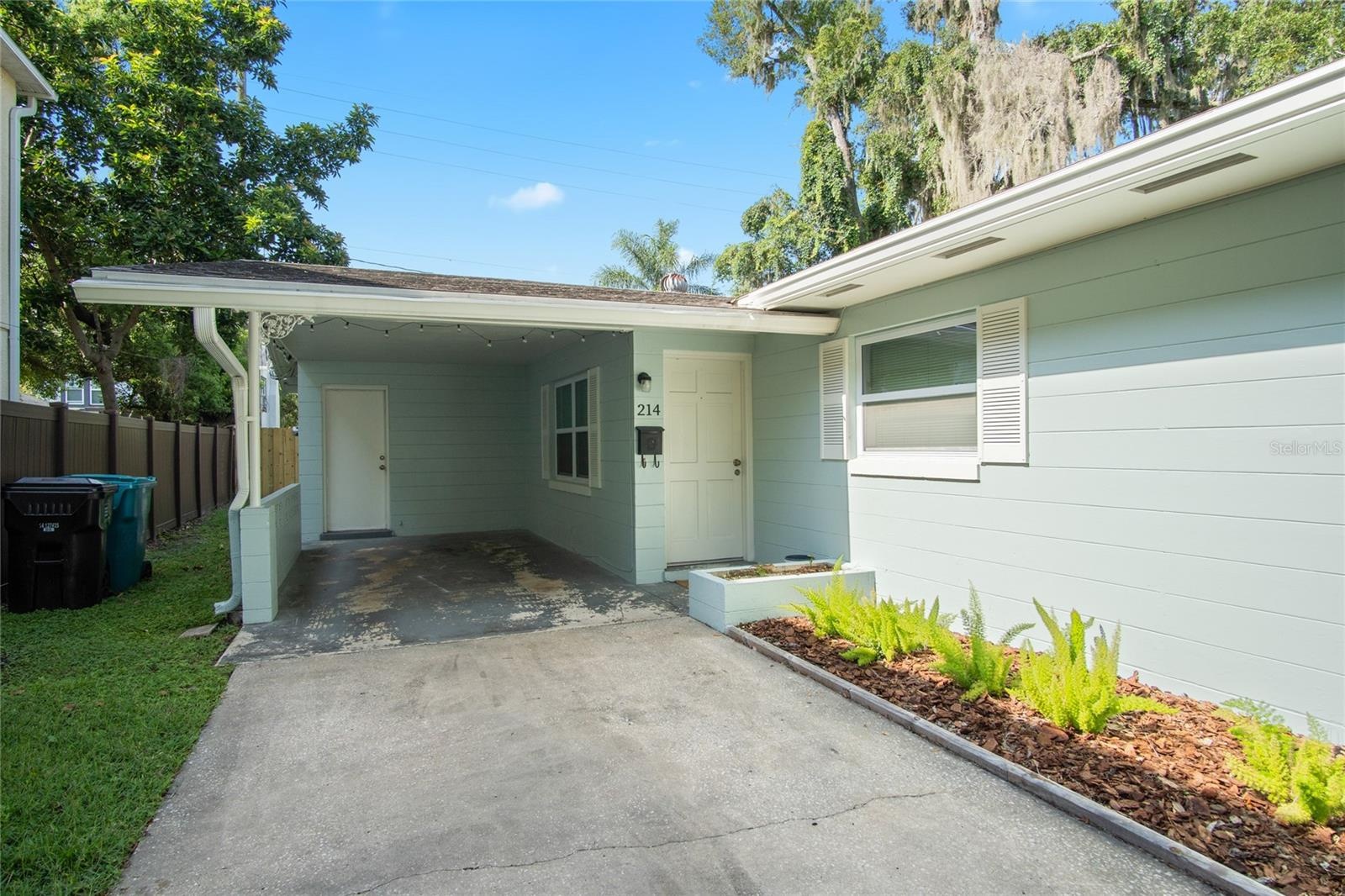 Carports provide covered parking along with driveway parking.