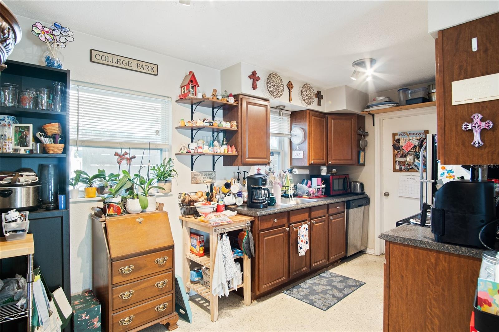The kitchen provides a range, refrigerator, and dishwasher.