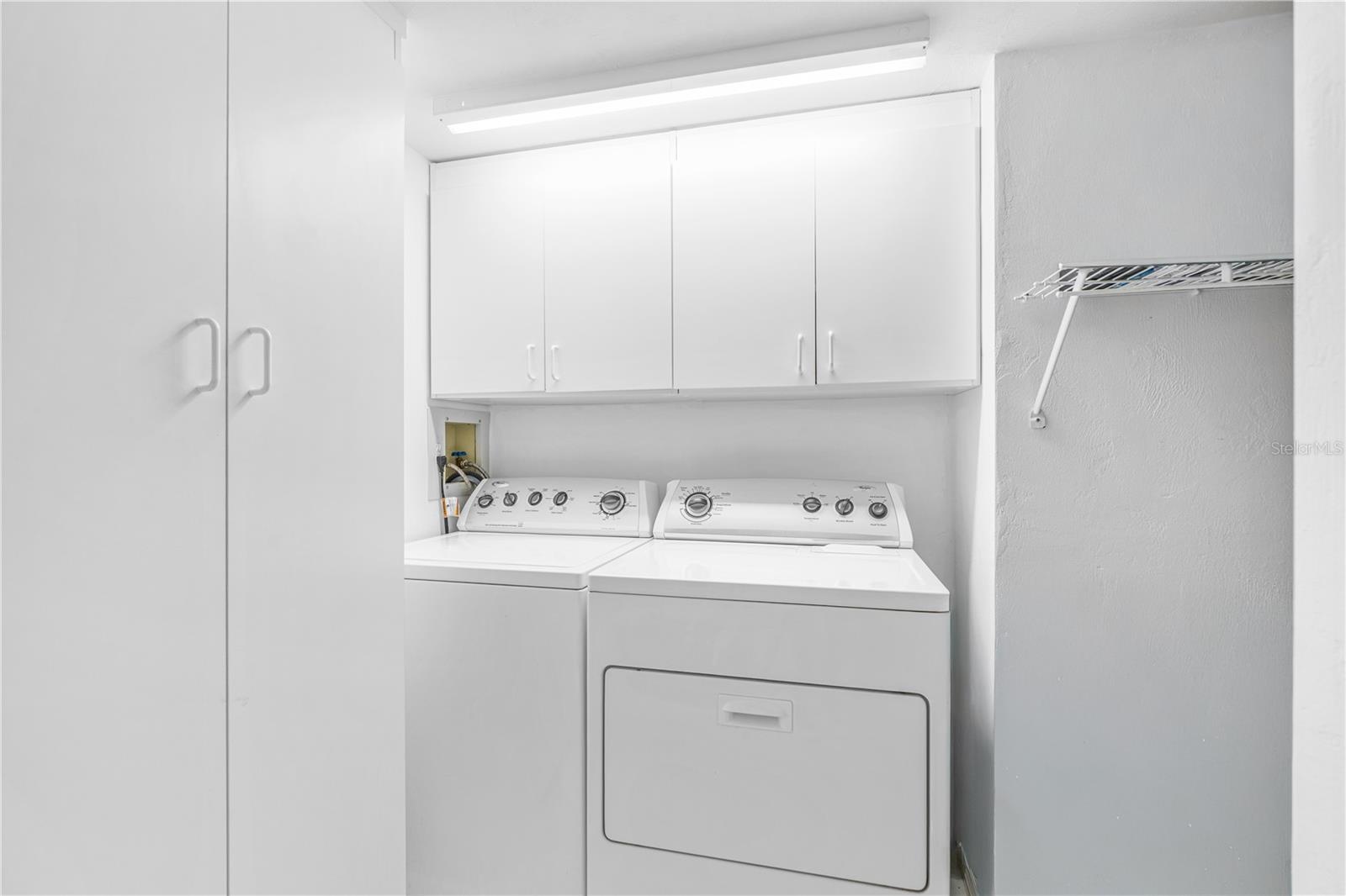 Inside Laundry with plenty of Storage