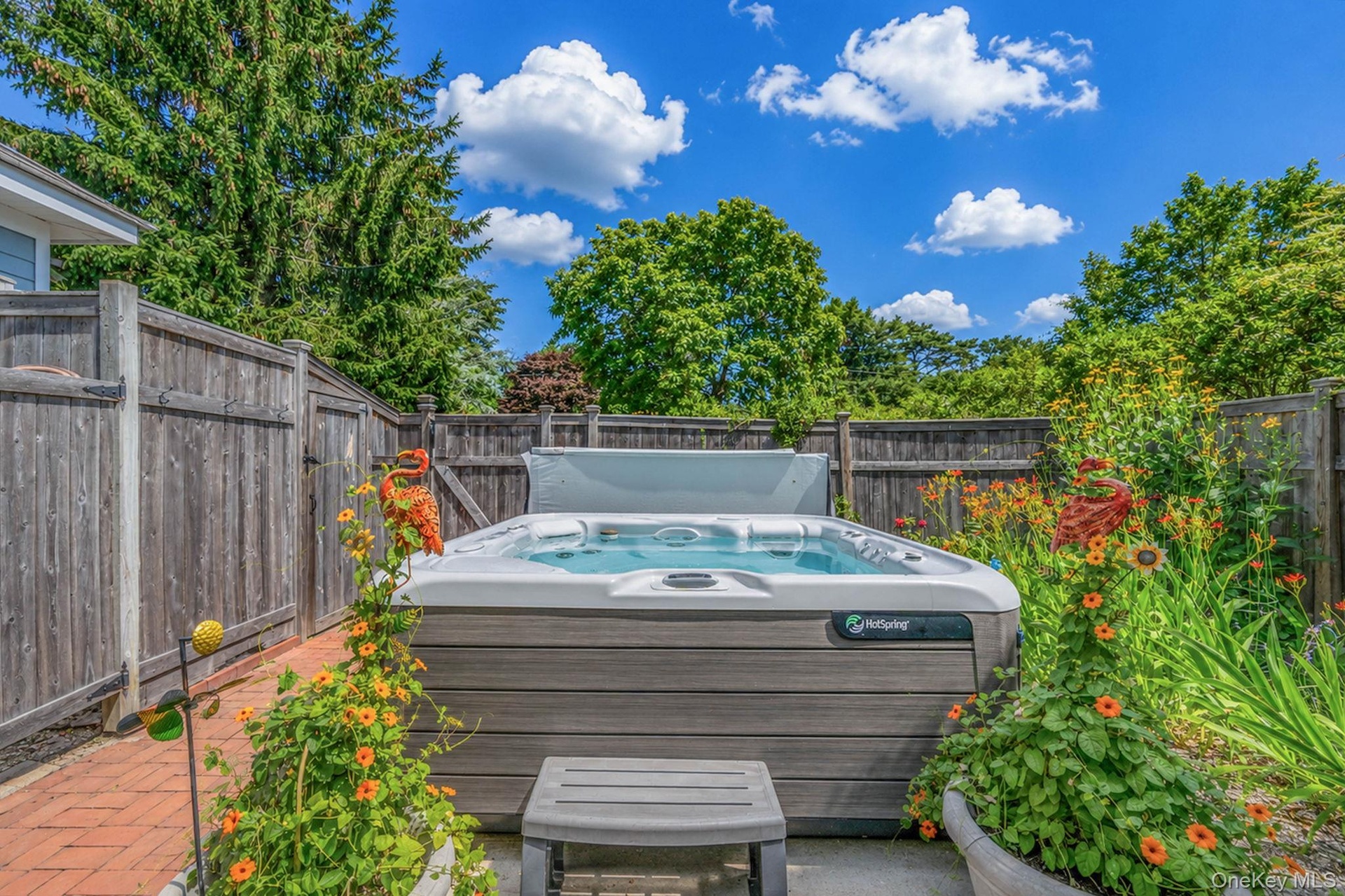 outdoor Spa seats 5 located near outdoor show and pool