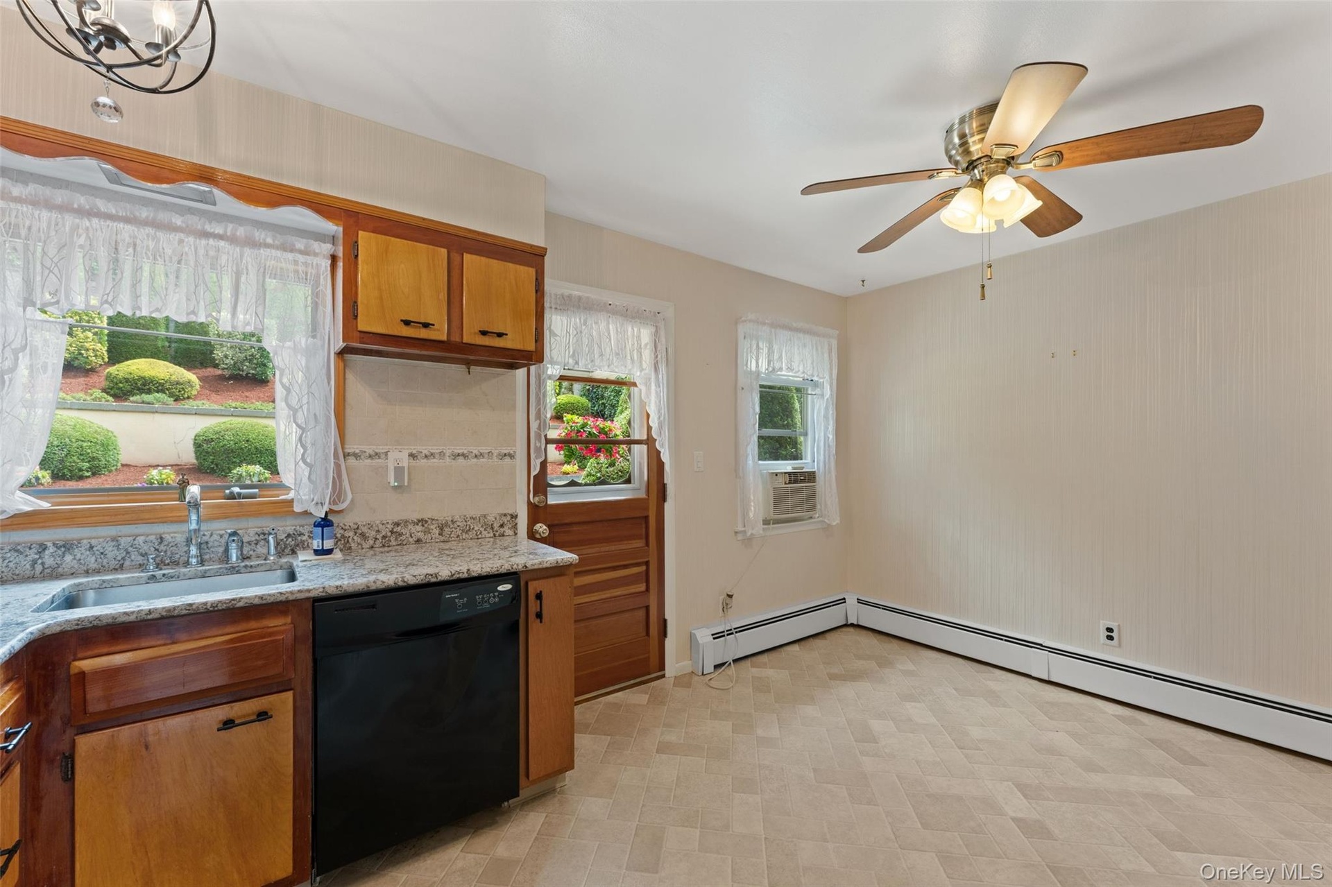 Dine-In Kitchen with view of access to the patio and garden.