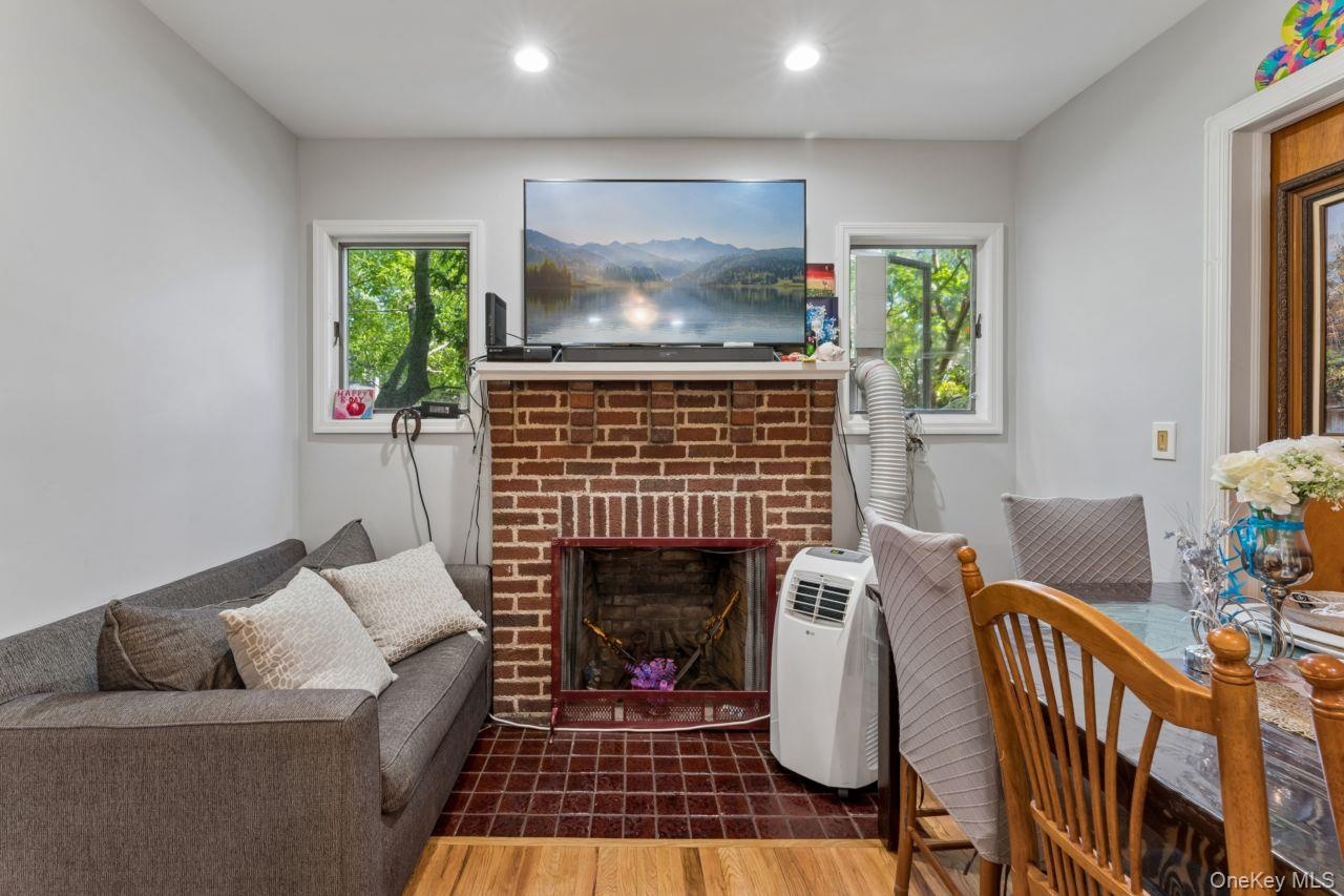 1st floor living room with a real fireplace