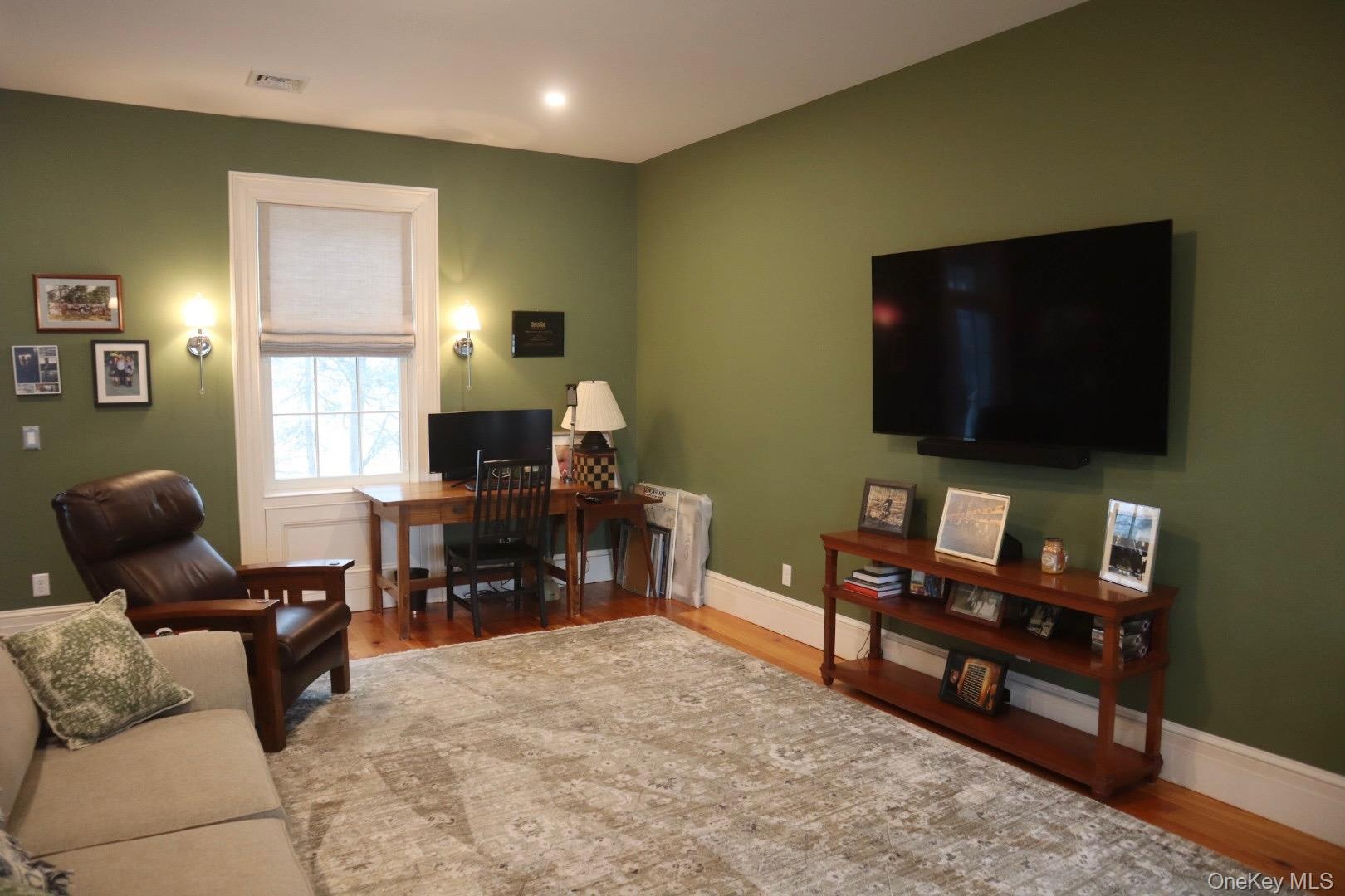Office area featuring hardwood / wood-style floors