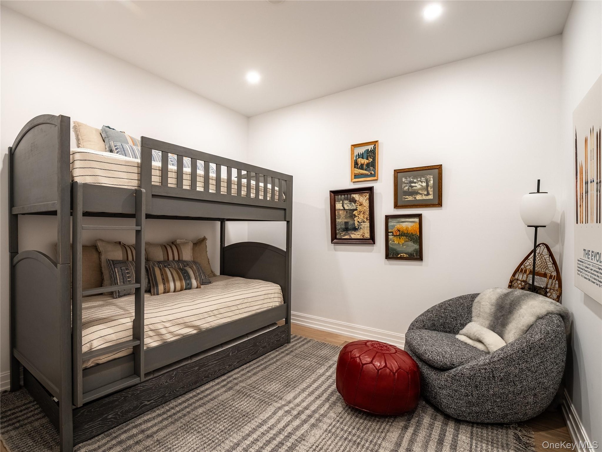 Bedroom with wood finished floors and recessed lighting