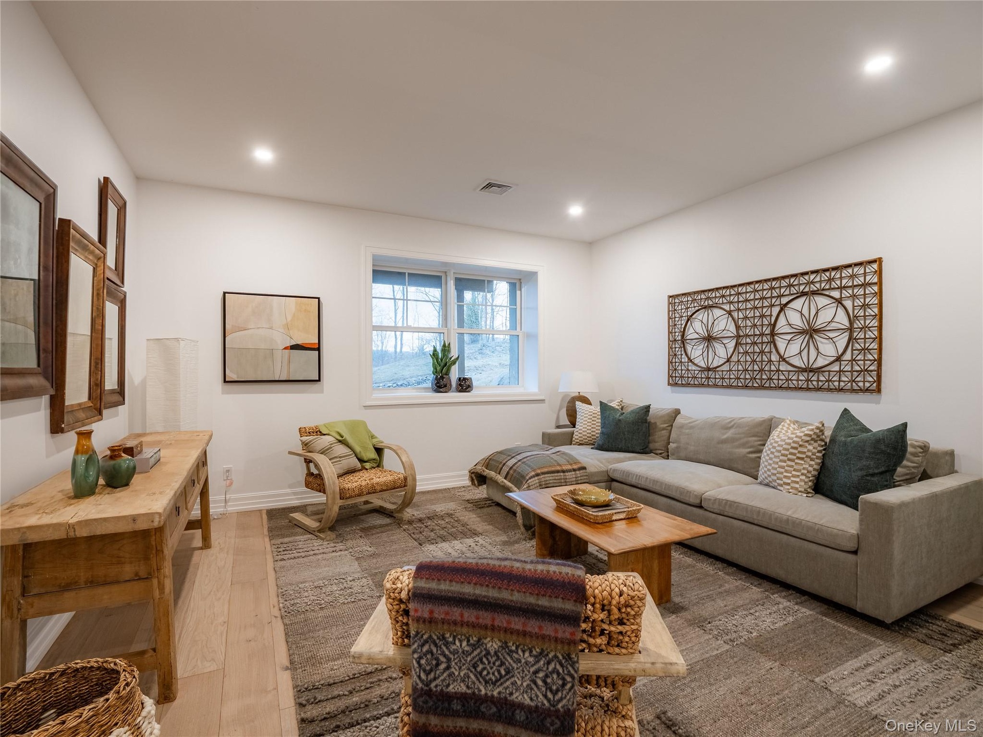 Living room featuring wood finished floors and recessed lighting