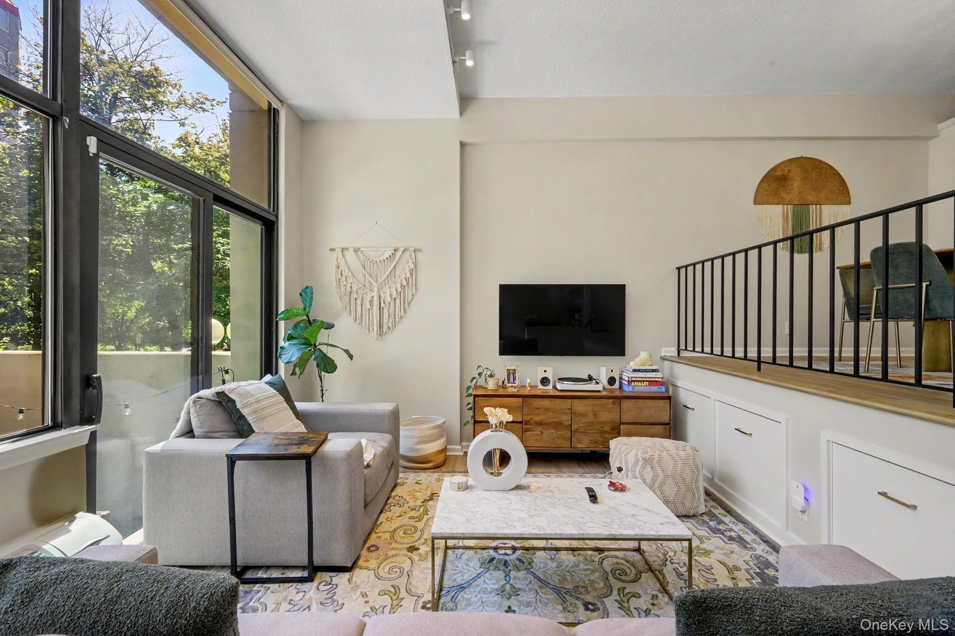 The impressive living room offers a wonderful sense of openness while maintaining just the right amount of separation from the kitchen and dining area
