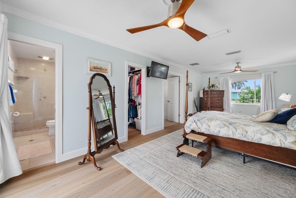 Primary Bedroom - View from Sliding Glass Door - En-Suite Bathroom - Walk-In Closet - Hallway Entrance