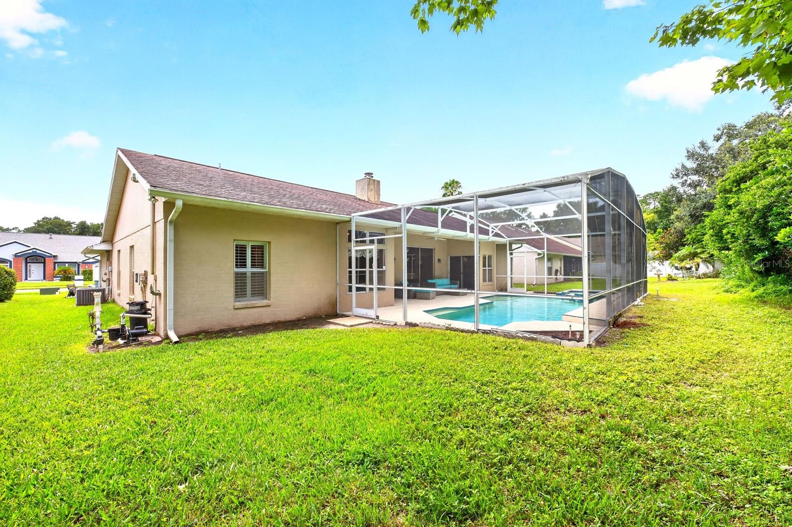 The expansive backyard is perfect for gatherings and weekend barbecues.