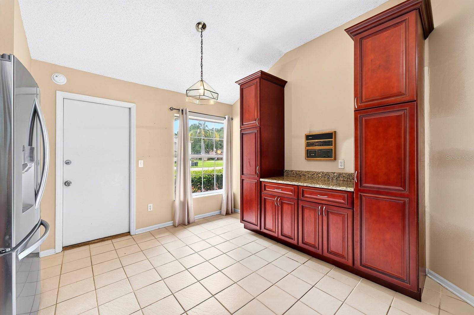 The Kitchen overlooks the Family Room and is ready for the home chef with NEW STAINLESS STEEL APPLIANCES, granite countertops, an abundance of wood ca