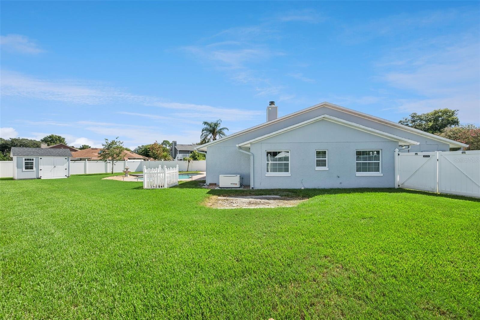Backyard Oasis with Pool/Storage Shed and Fenced-In Backyard