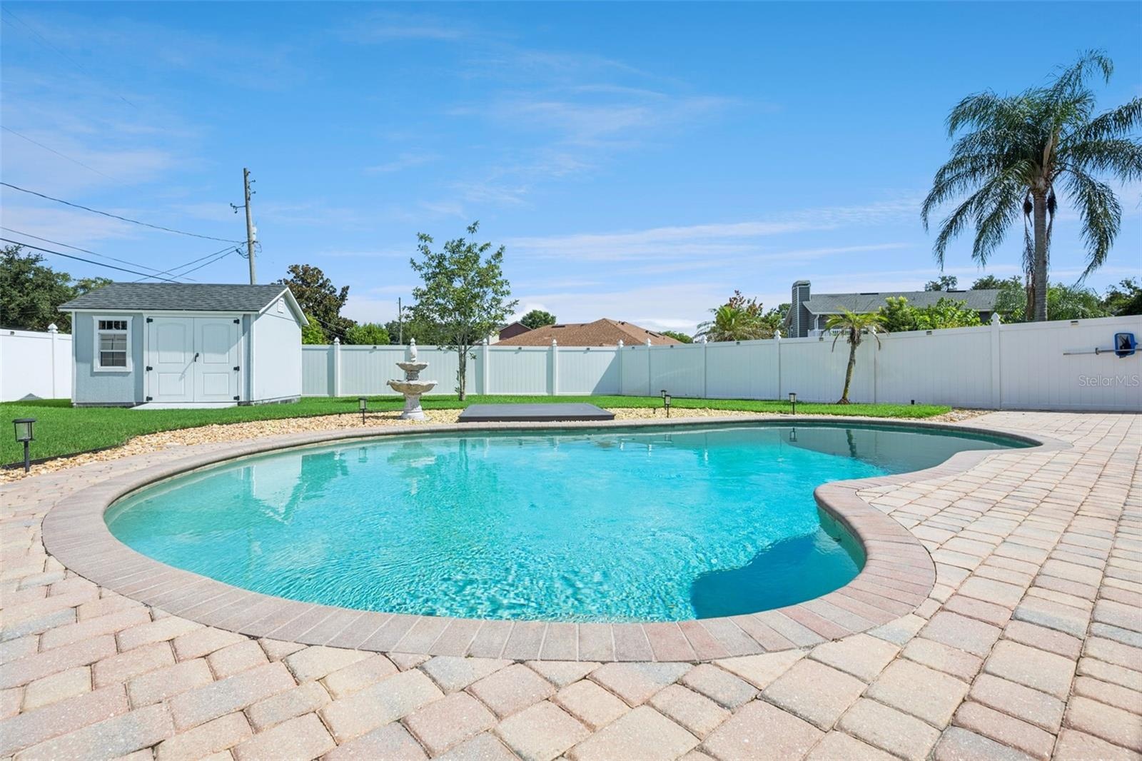 Backyard Oasis with Pool/Storage Shed and Fenced-In Backyard
