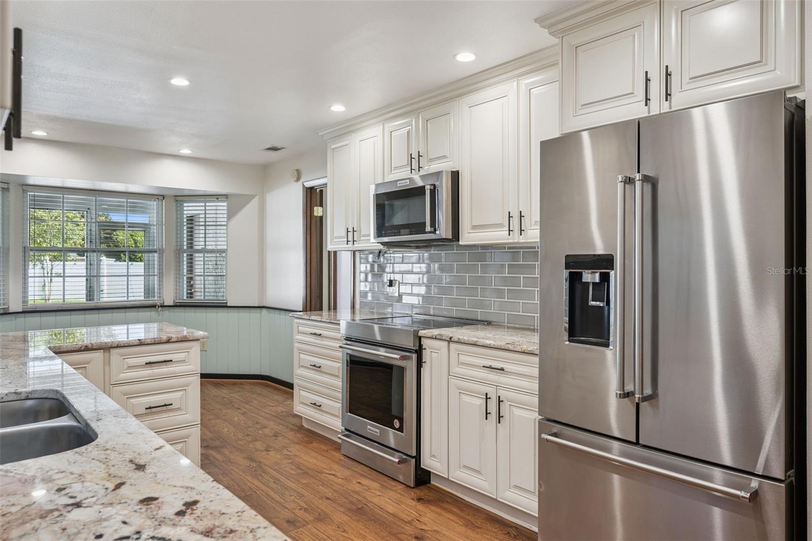 Remodeled Kitchen with Granite Countertops and Stainless Steel Appliances