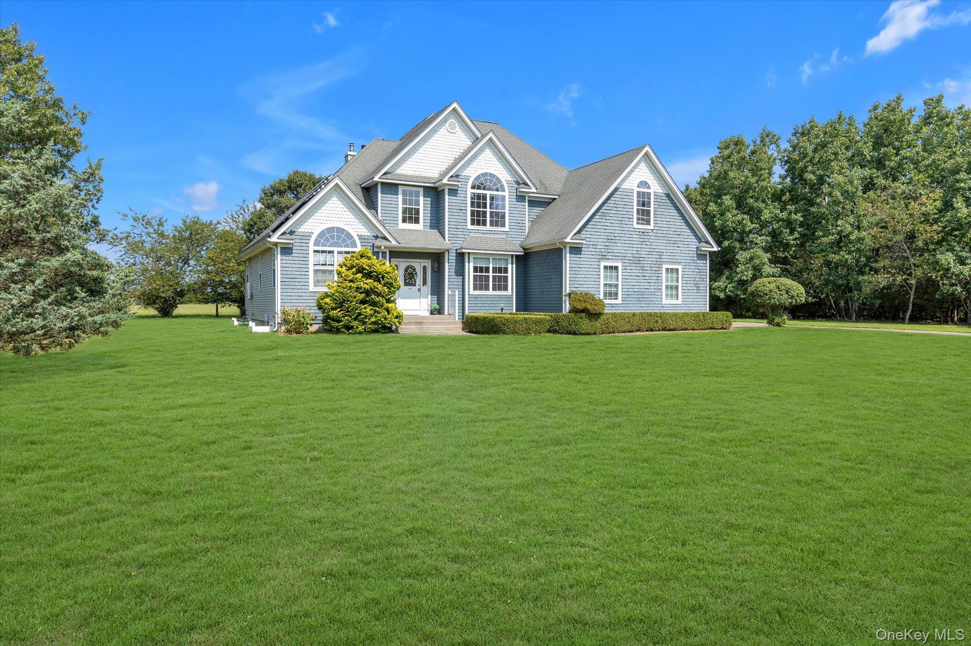Siding exterior with multiple gables and dormer windows