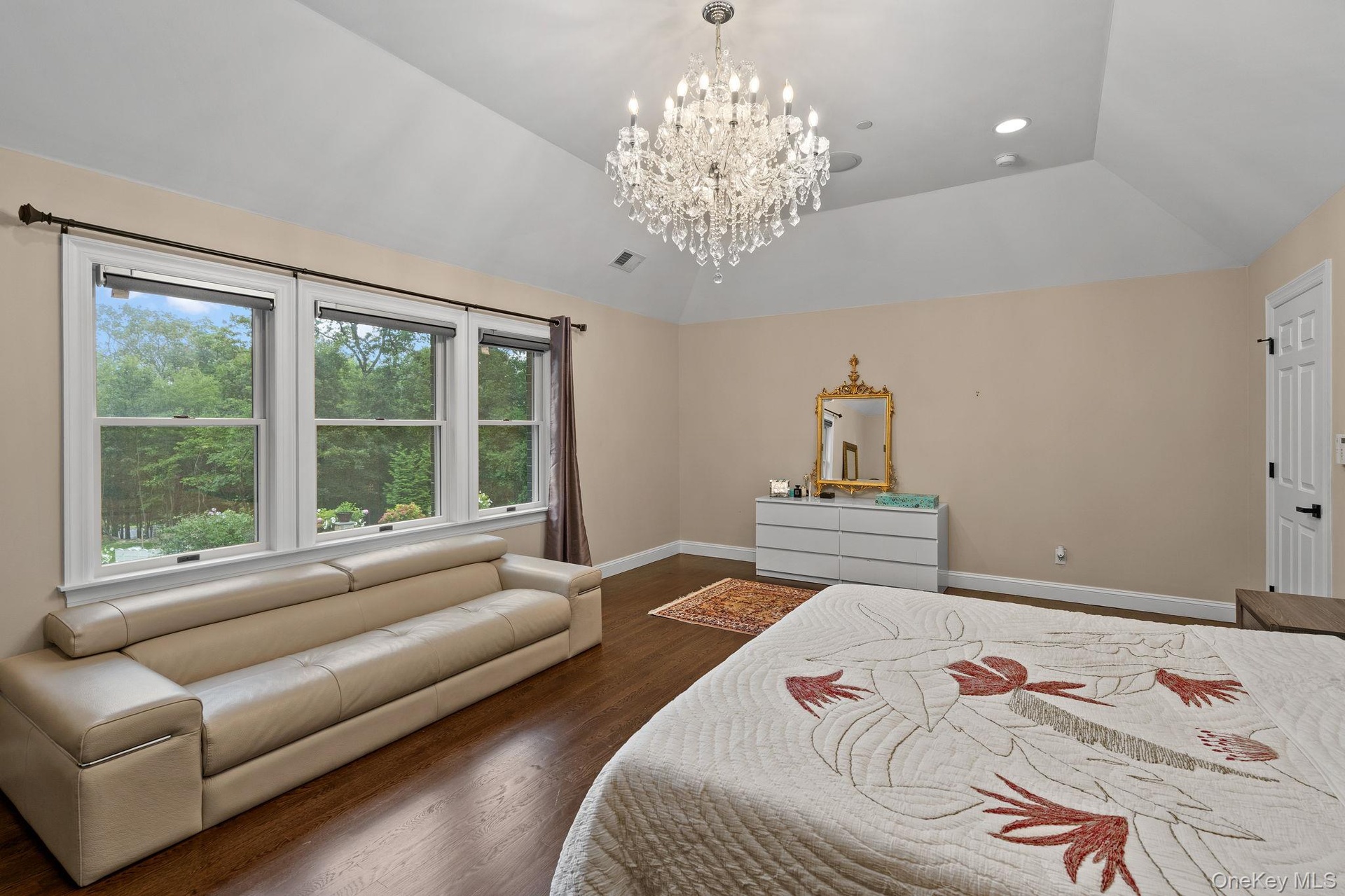 Bedroom featuring a chandelier, dark wood-type flooring, lofted ceiling, and recessed lighting