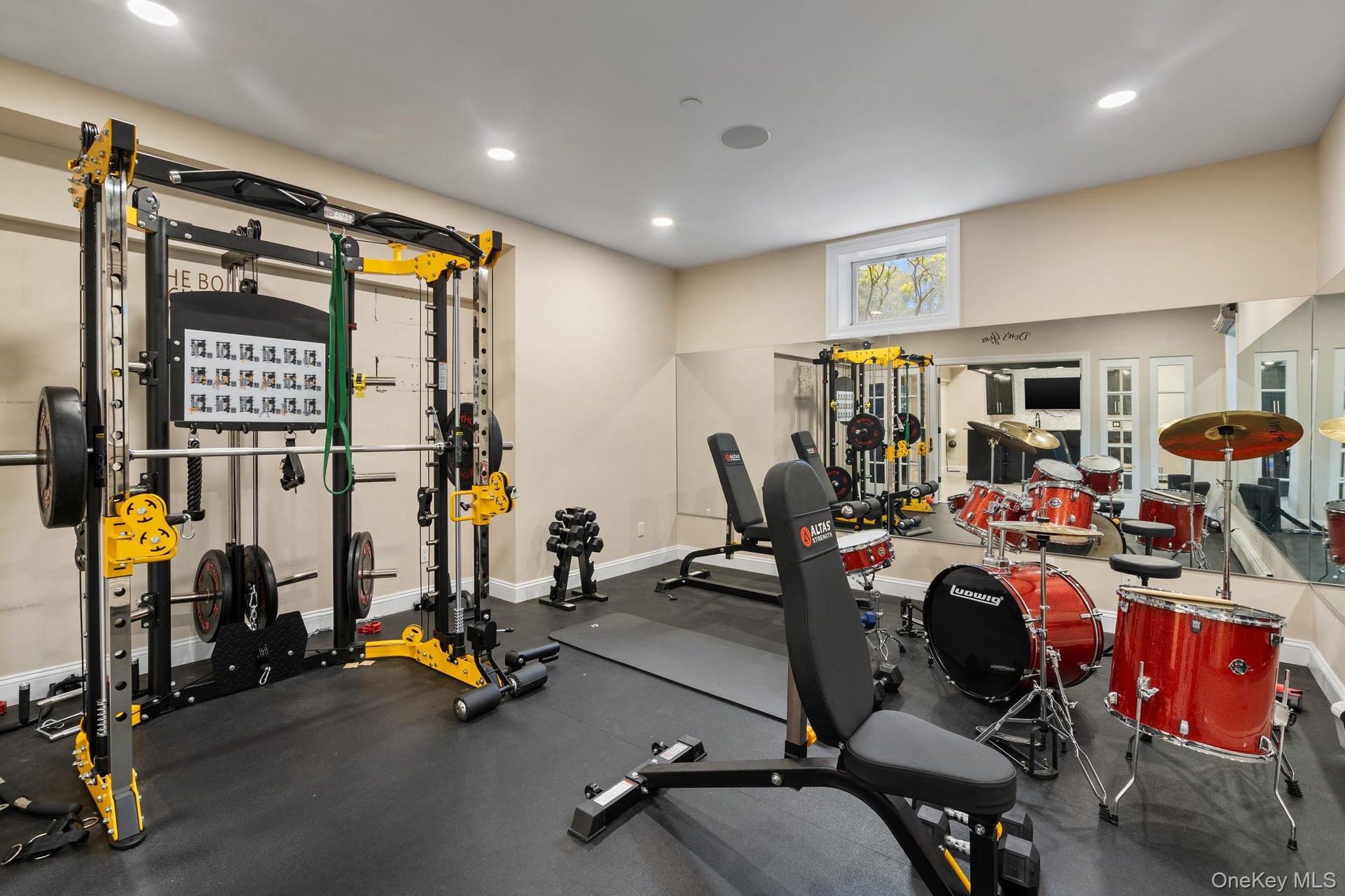 Workout area featuring recessed lighting
