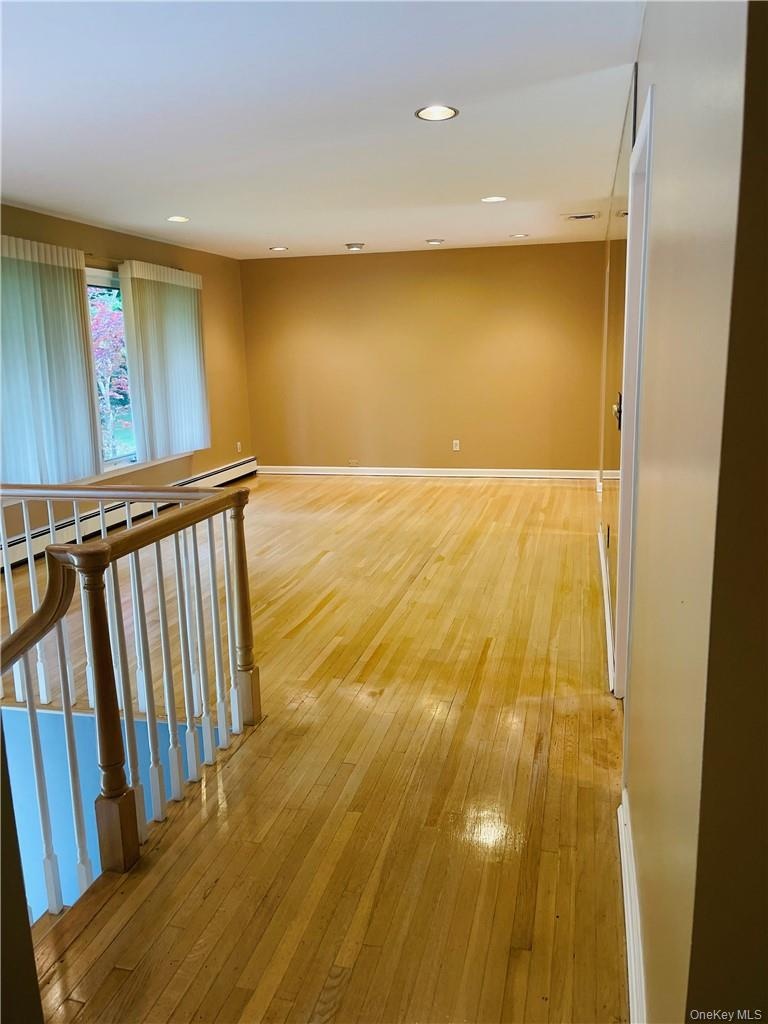 Living room with freshly polyurethaned wood floors