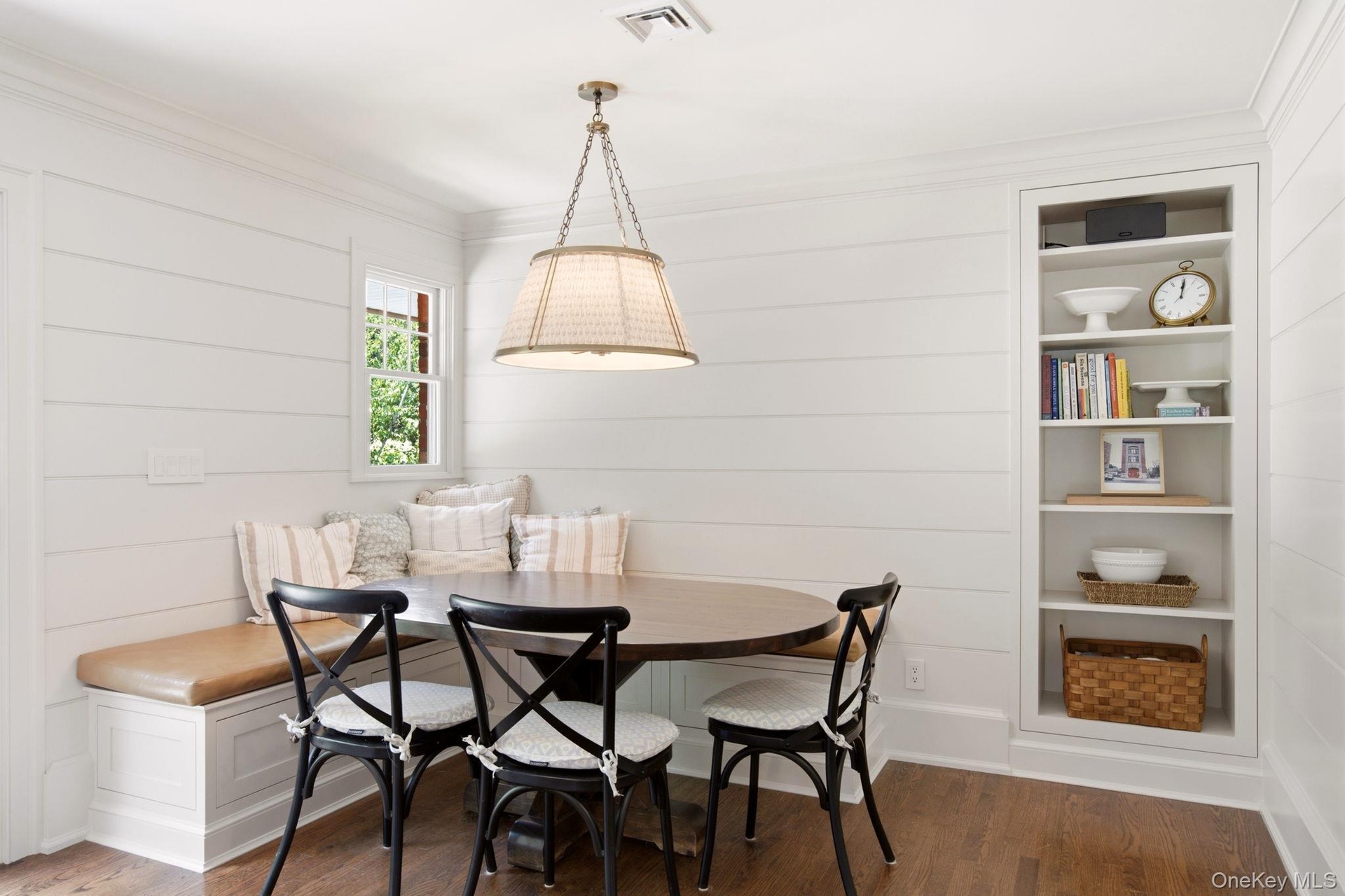 Beautiful shiplap feature wall with built in shelving.