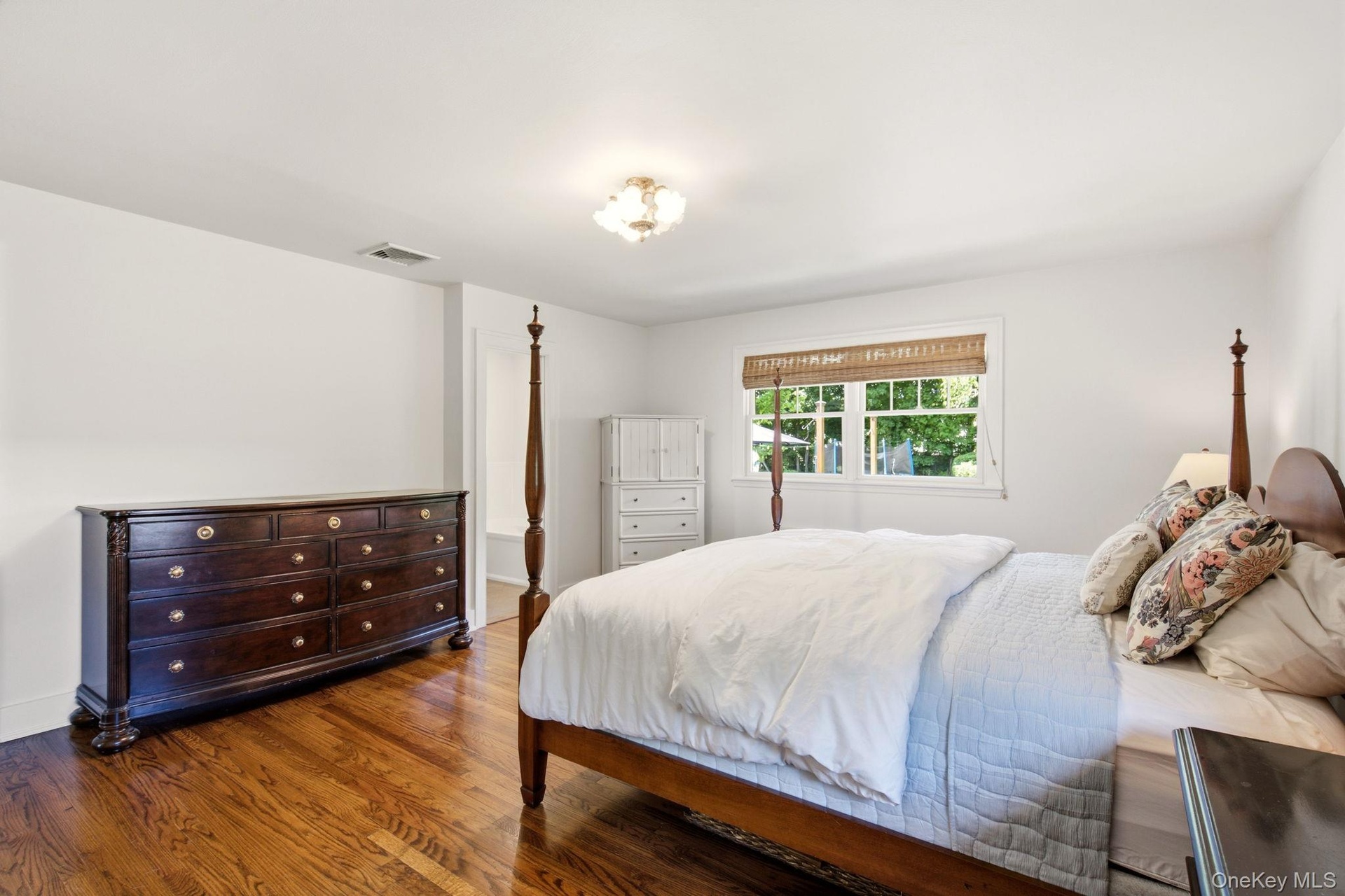 Gleaming wood floors are found in the Primary Suite.