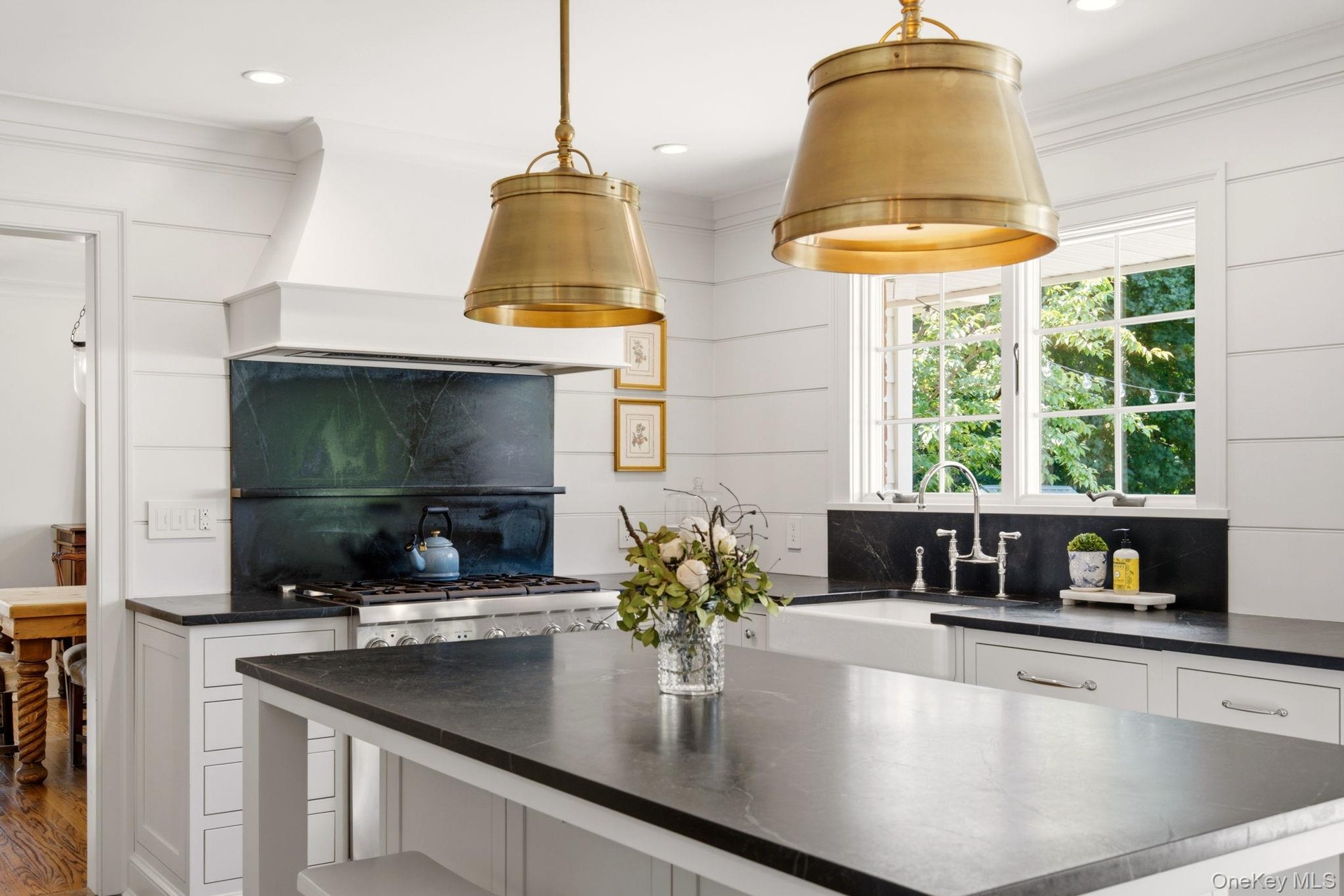 Kitchen windows with views of the yard.