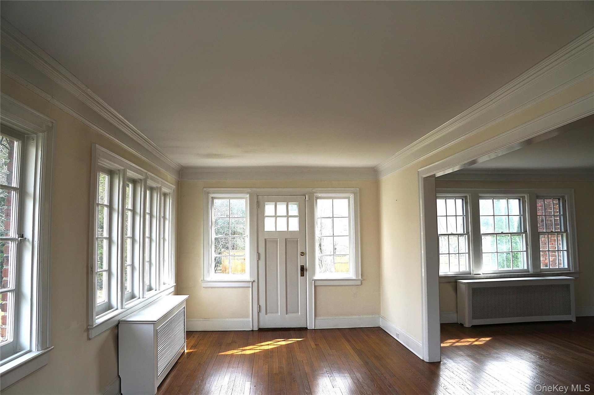 Another angle of the den with the exit outside and the living room to its right