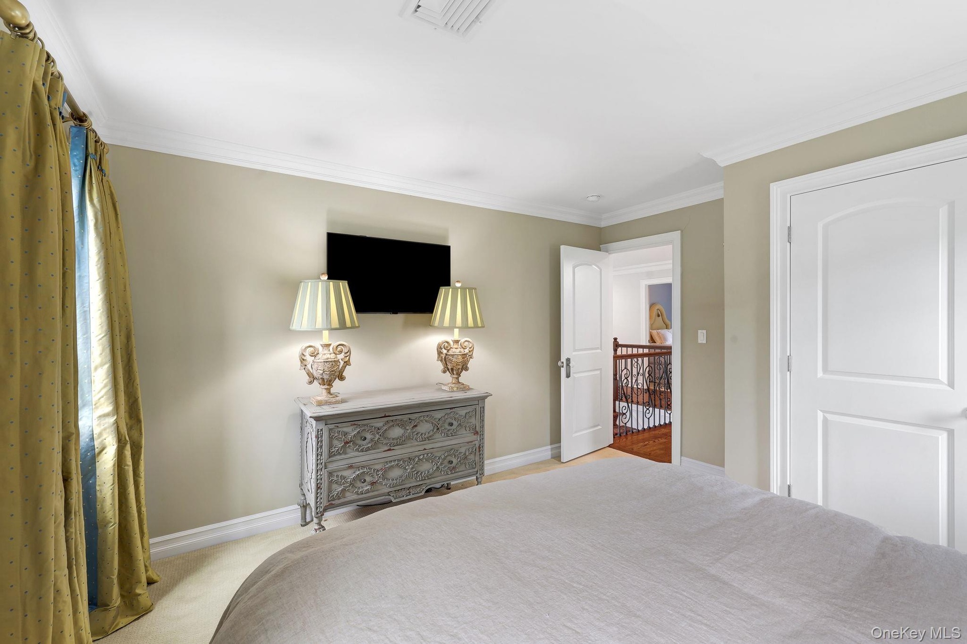 Crown molding and neutral wall tones create a refined aesthetic
