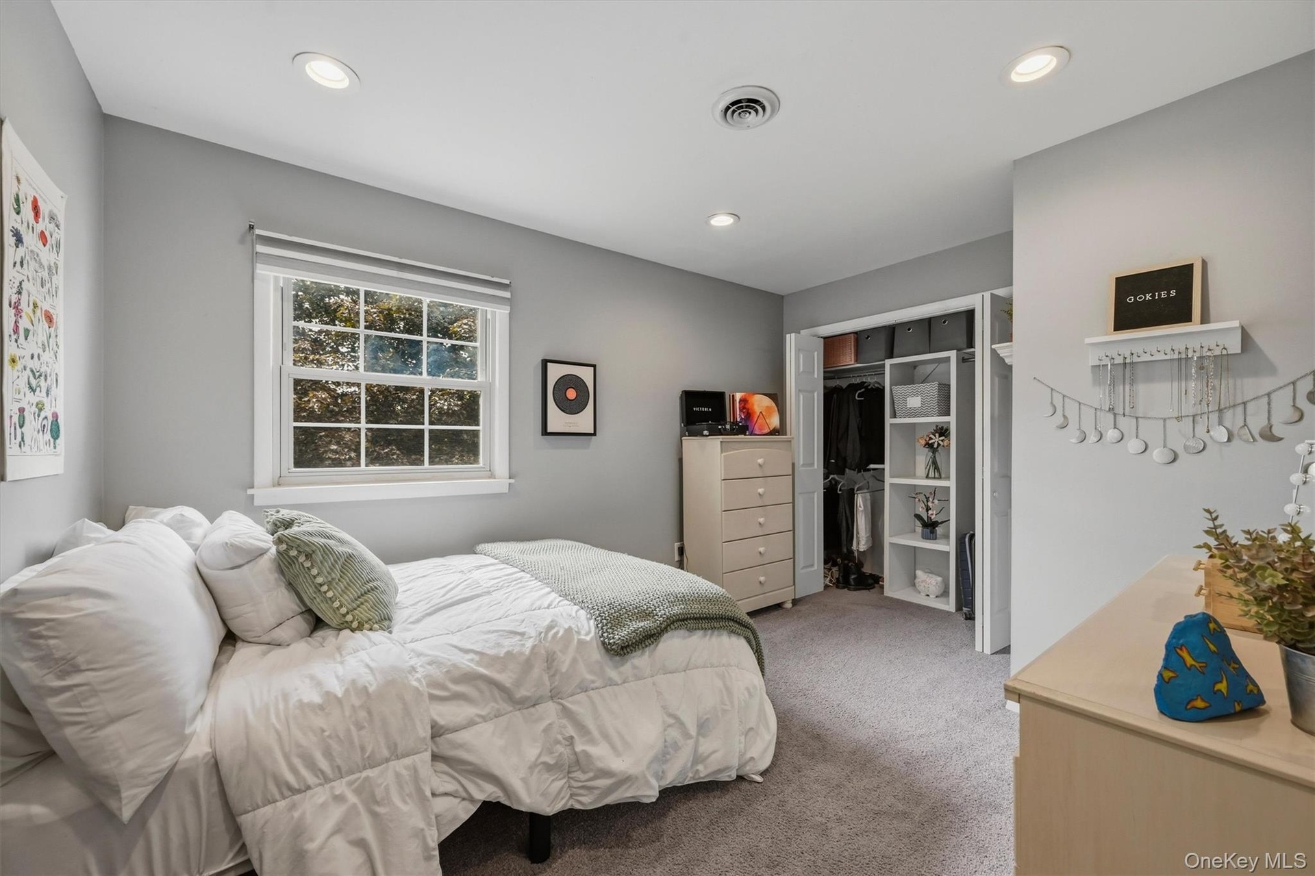 This bedrooms offers a unique closet system.