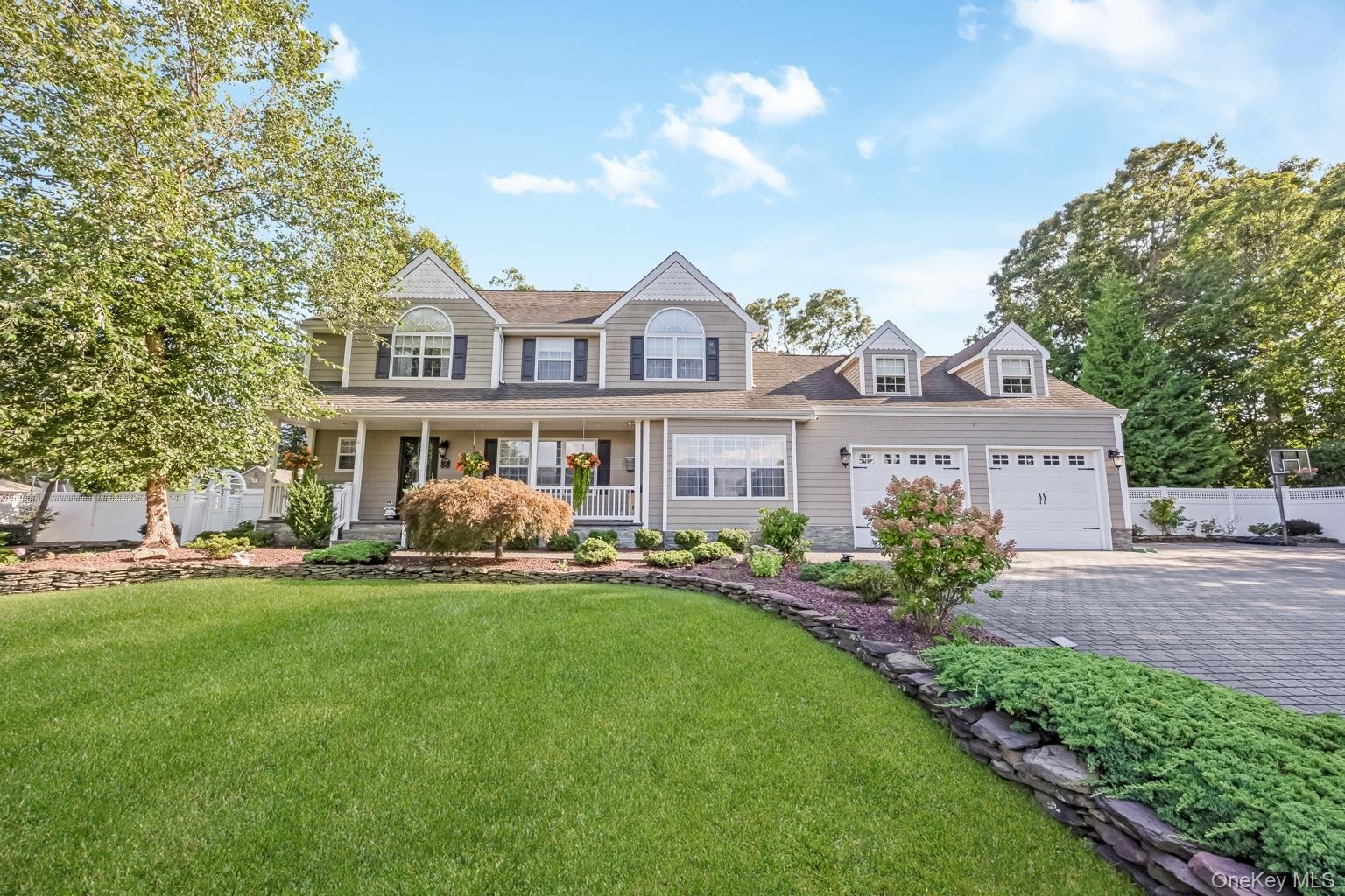 Two-story residence with a covered front porch and dormer windows